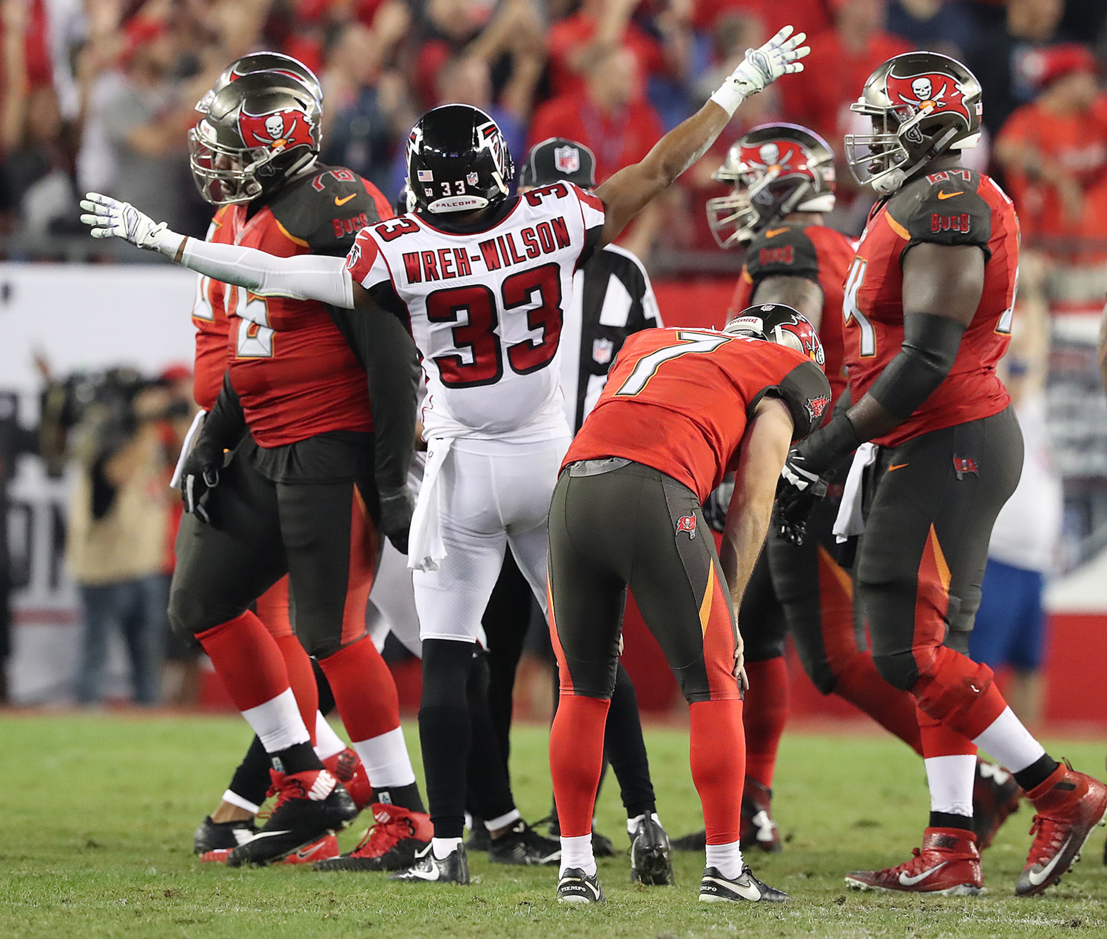 December 18, 2017 Tampa: Buccaneers kicker Patrick Murray drops his head in dejection missing a field goal that would have tied the game as time expires while Falcons cornerback Blidi Wreh-Wilson starts the celebration holding on for a 24-21 victory over the Bucs in a NFL football game on Monday, December 18, 2017, in Tampa. Curtis Compton/ccompton@ajc.com