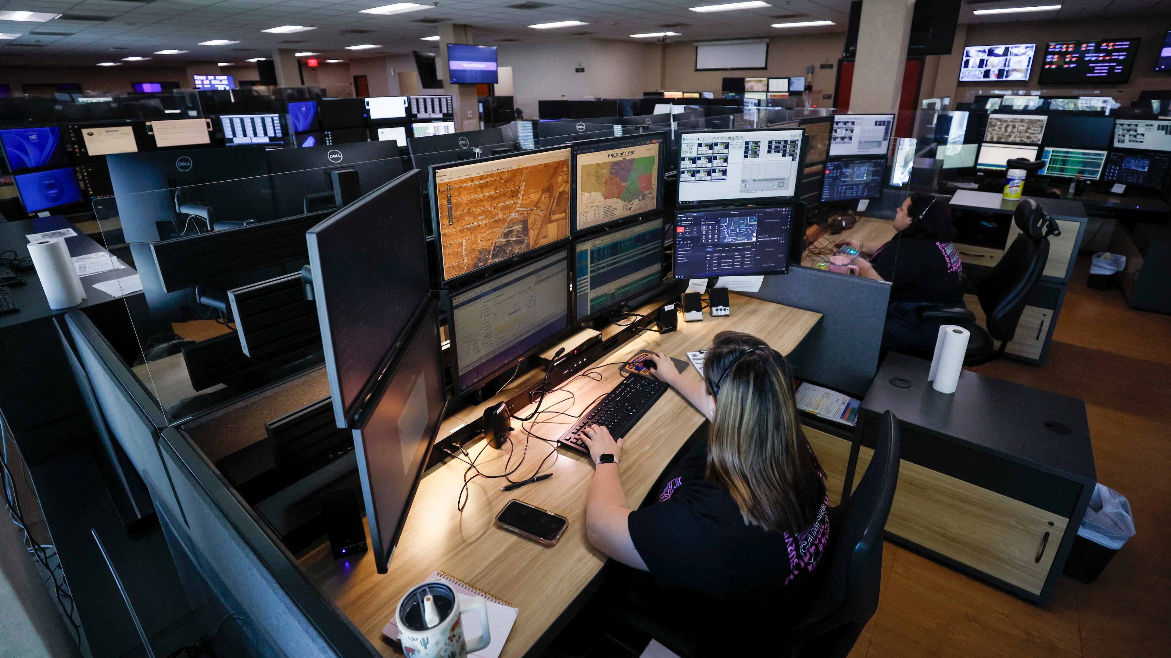 After a recent tech upgrade, emergency communication officer Julianna Shetterly and fellow Cobb dispatchers can see a map with the exact location of every cellphone contacting them. (Miguel Martinez/AJC)