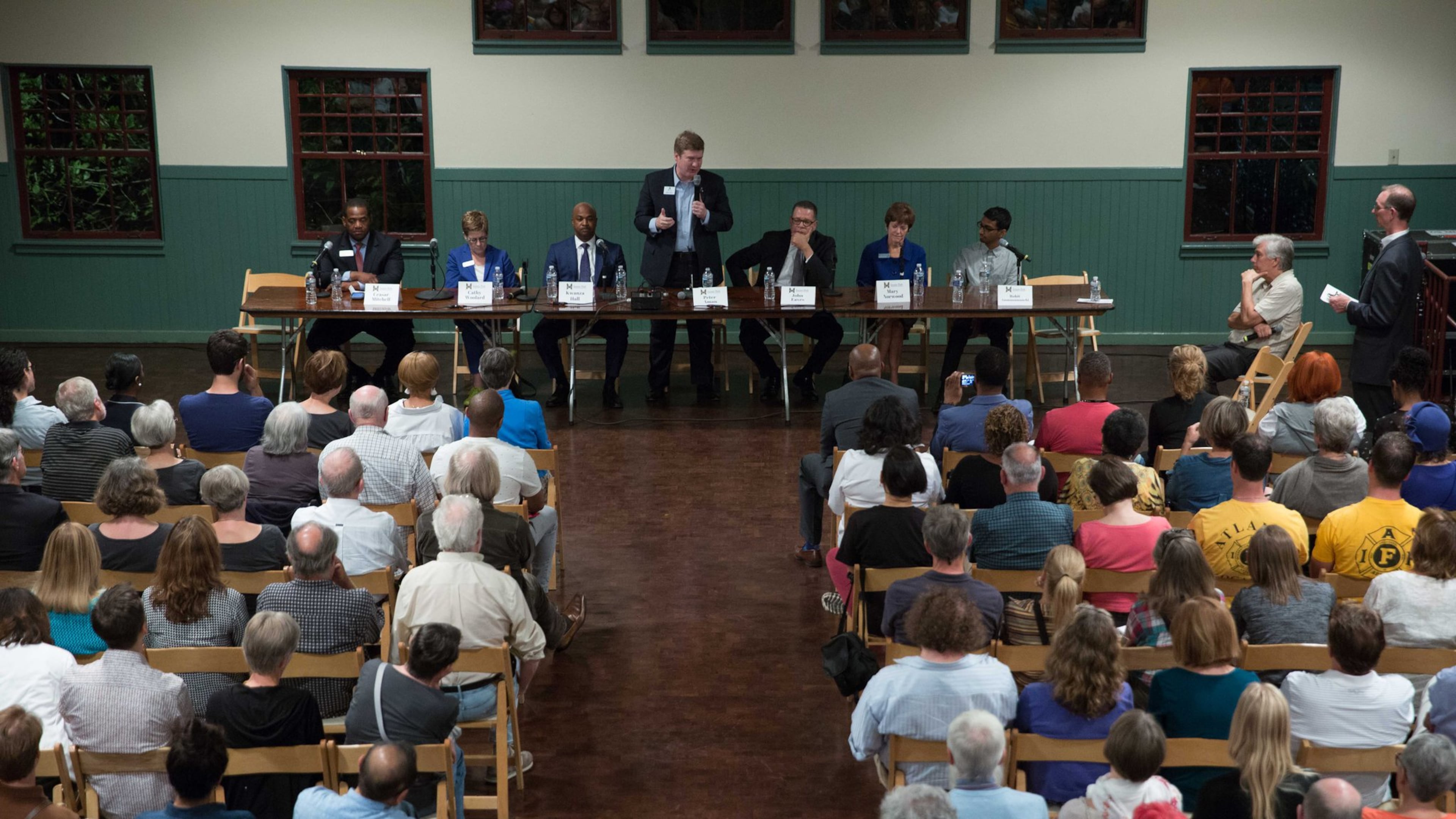 Atlanta mayoral candidate Peter Aman (center), a former city chief operating officer, talks during an Inman Park mayoral candidate forum in The Trolley Barn, Wednesday, Oct. 4, 2017, in Atlanta. Seven of the nine major mayoral candidates have ties to City Hall. BRANDEN CAMP / SPECIAL