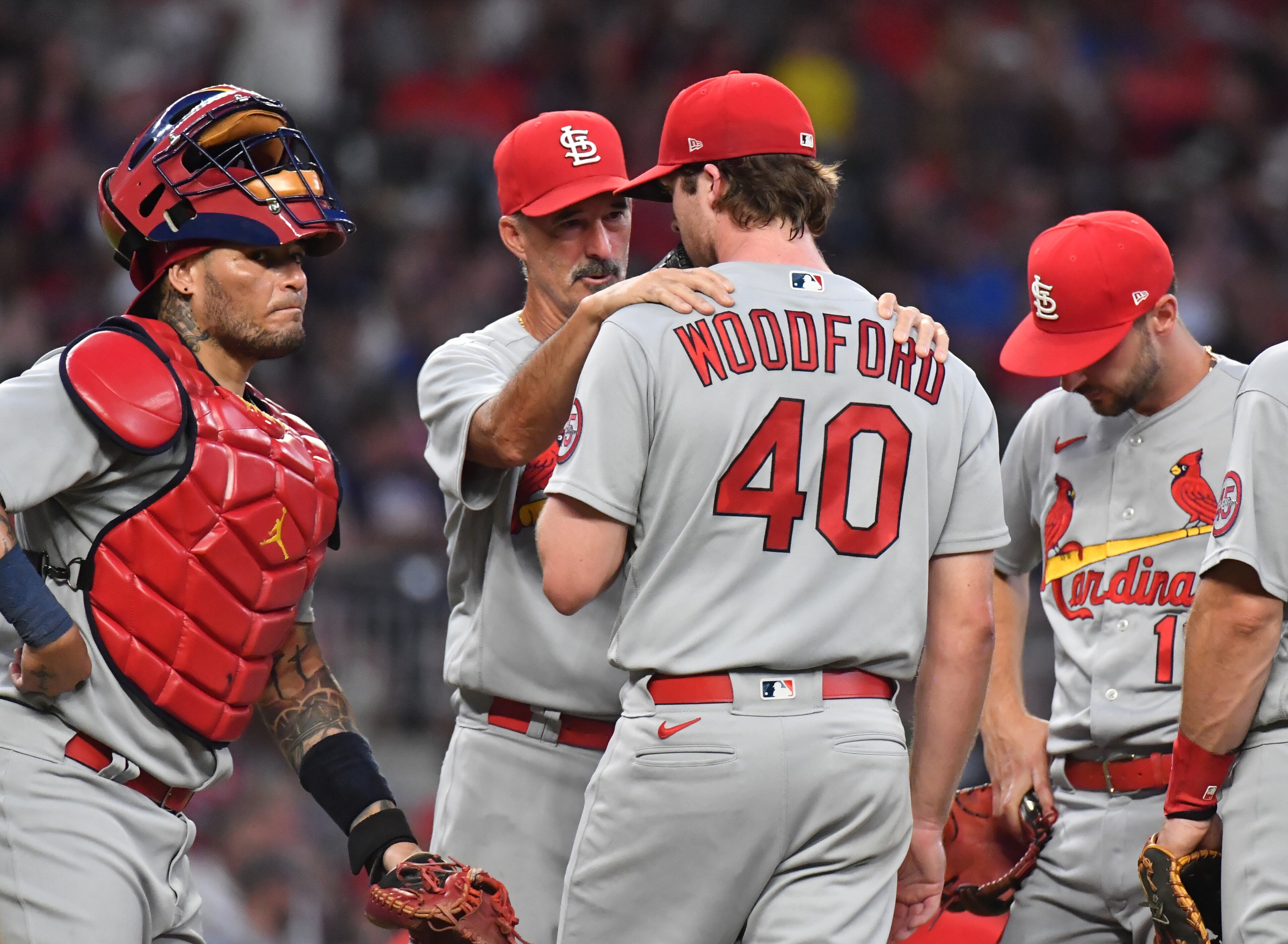 St. Louis Cardinals pitching coach Mike Maddux (31) confers with pitcher Jake Woodford. (Hyosub Shin / Hyosub.Shin@ajc.com)