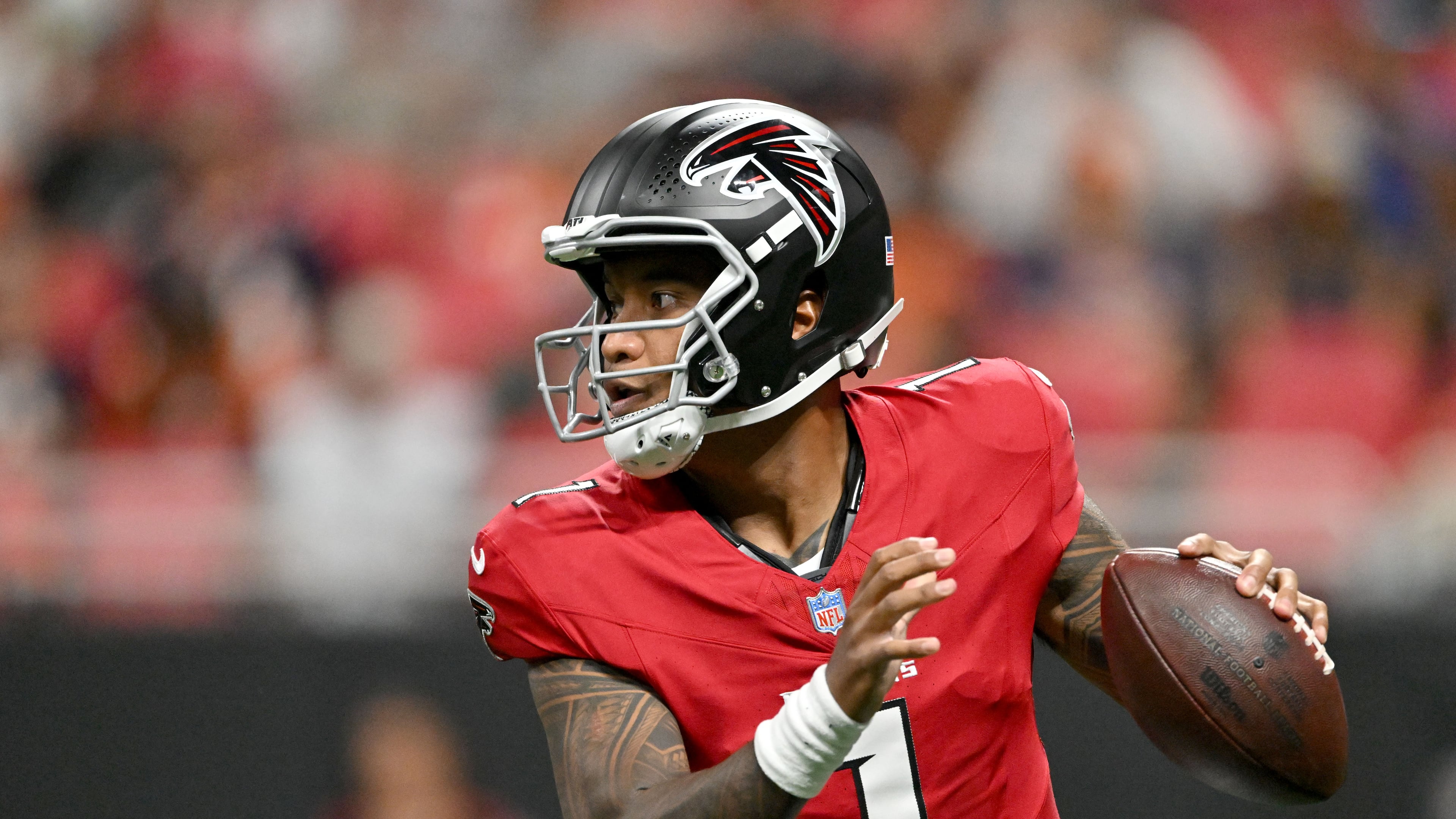 Falcons quarterback Tua Tagovailoa — pictured looking to pass against the Broncos in a preseason game Friday, Aug. 14, 2026 — was named Atlanta's starting quarterback after signing with the team in March. (Hyosub Shin/AJC)