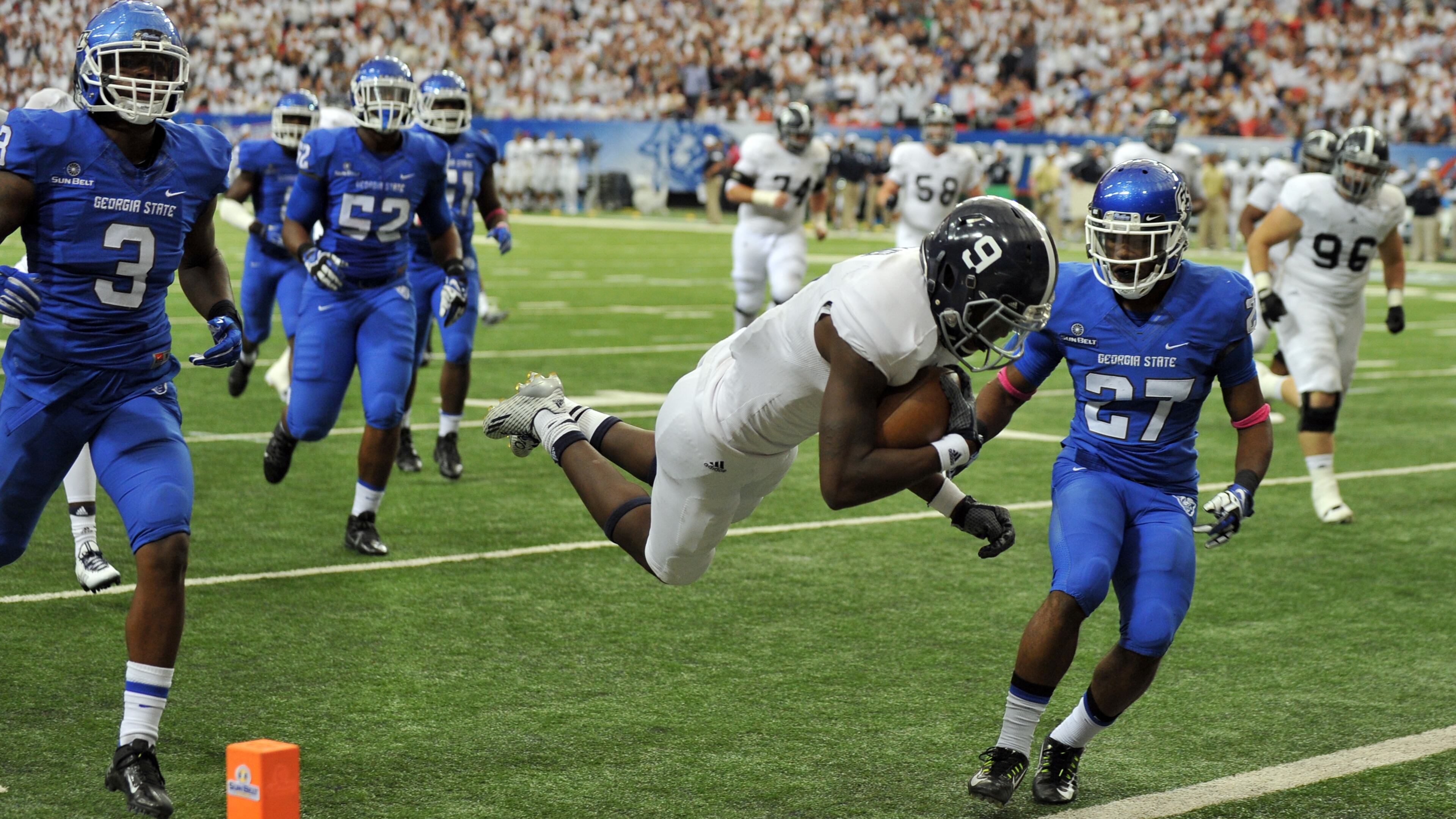 Georgia Southern Eagles wide receiver Zach Walker dives into the end zone for a second quarter touchdown against Georgia State at the Georgia Dome Saturday October 25, 2014. BRANT SANDERLIN / BSANDERLIN@AJC.COM