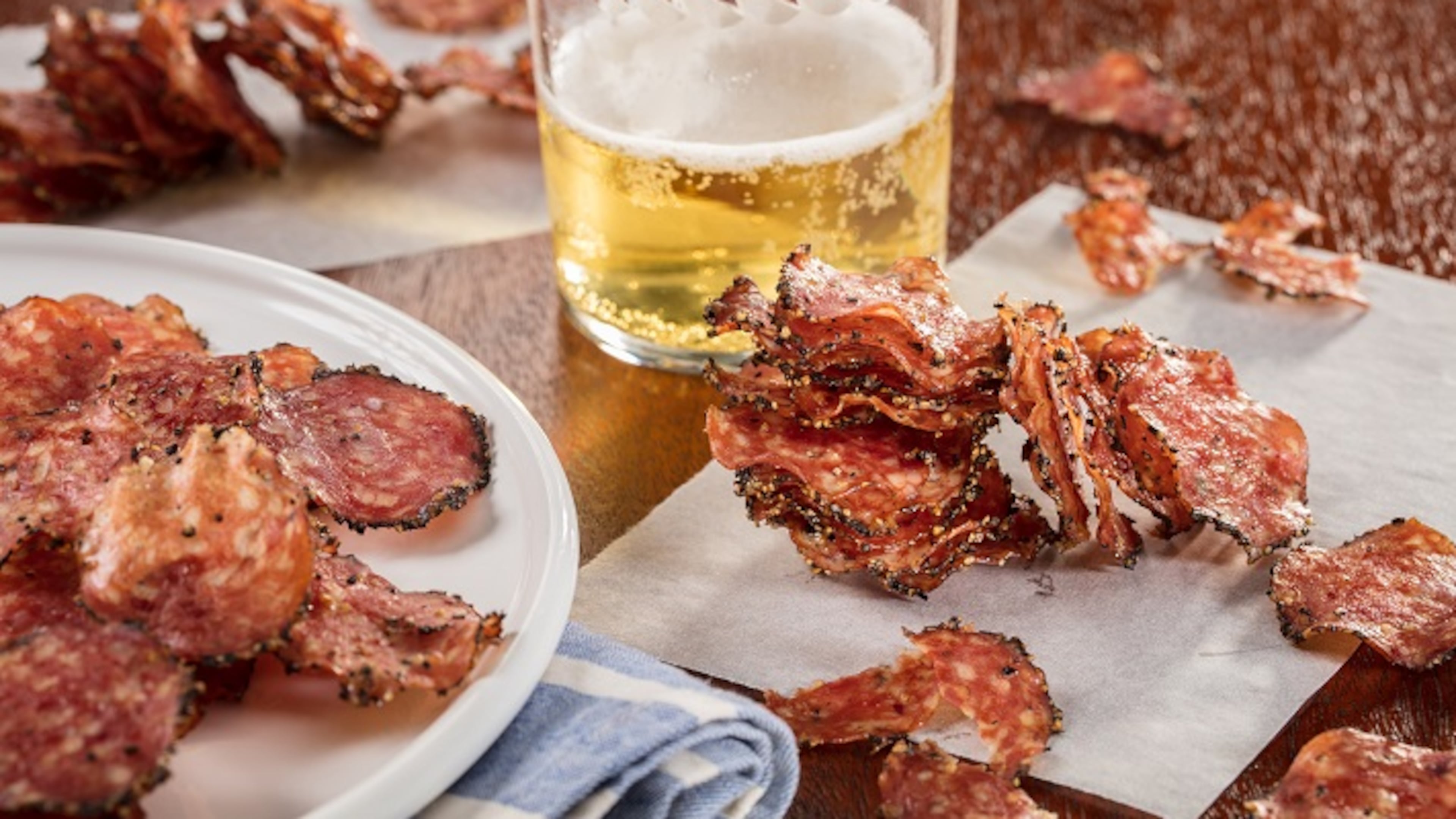 Peppered salami is sliced thinly then cooked in the oven. They become crisp as they cool, making an addictive snack. (Food styling by Mark Graham.) (Zbigniew Bzdak/Chicago Tribune/TNS)