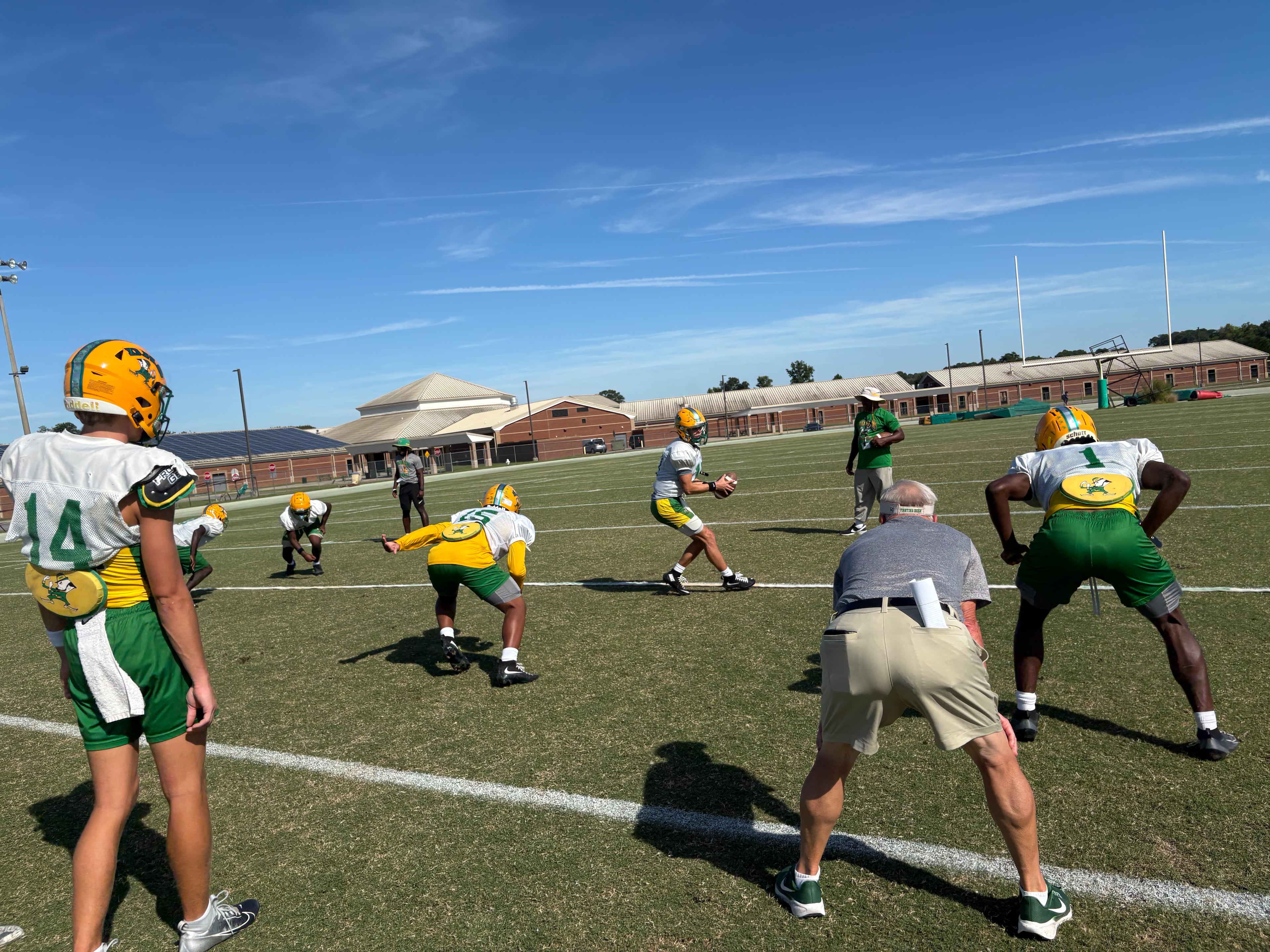 Roger Holmes watches his Wing-T offense work through plays catered for its next game. Holmes' team is 5-1 and ranked No. 5 in state in Class 2A. (Jack Leo/AJC)