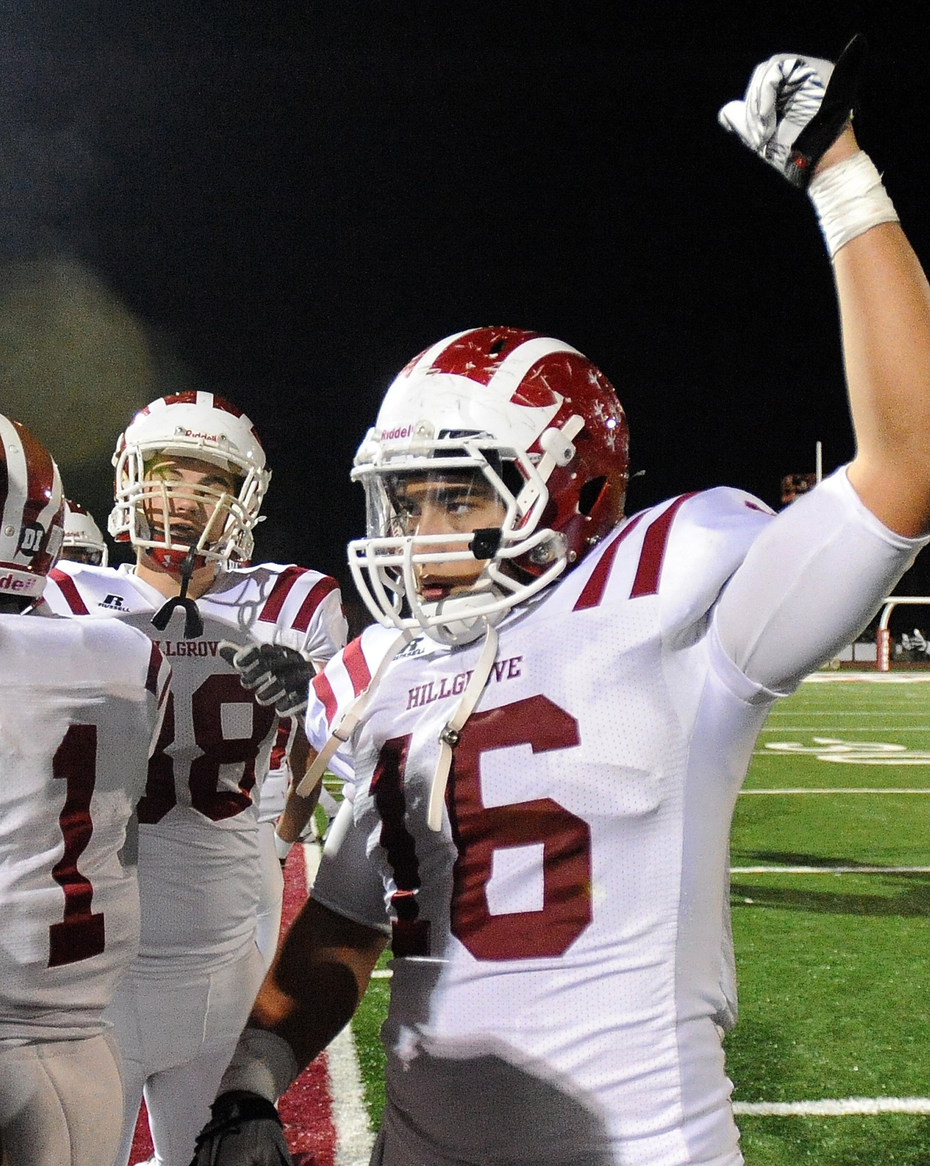 Hillgrove quarterback Conner Beck (16) celebrates the 31-17 victory over McEachern on Friday, Nov. 8, 2013, in Powder Springs, Ga. Hillgrove won 31-17.