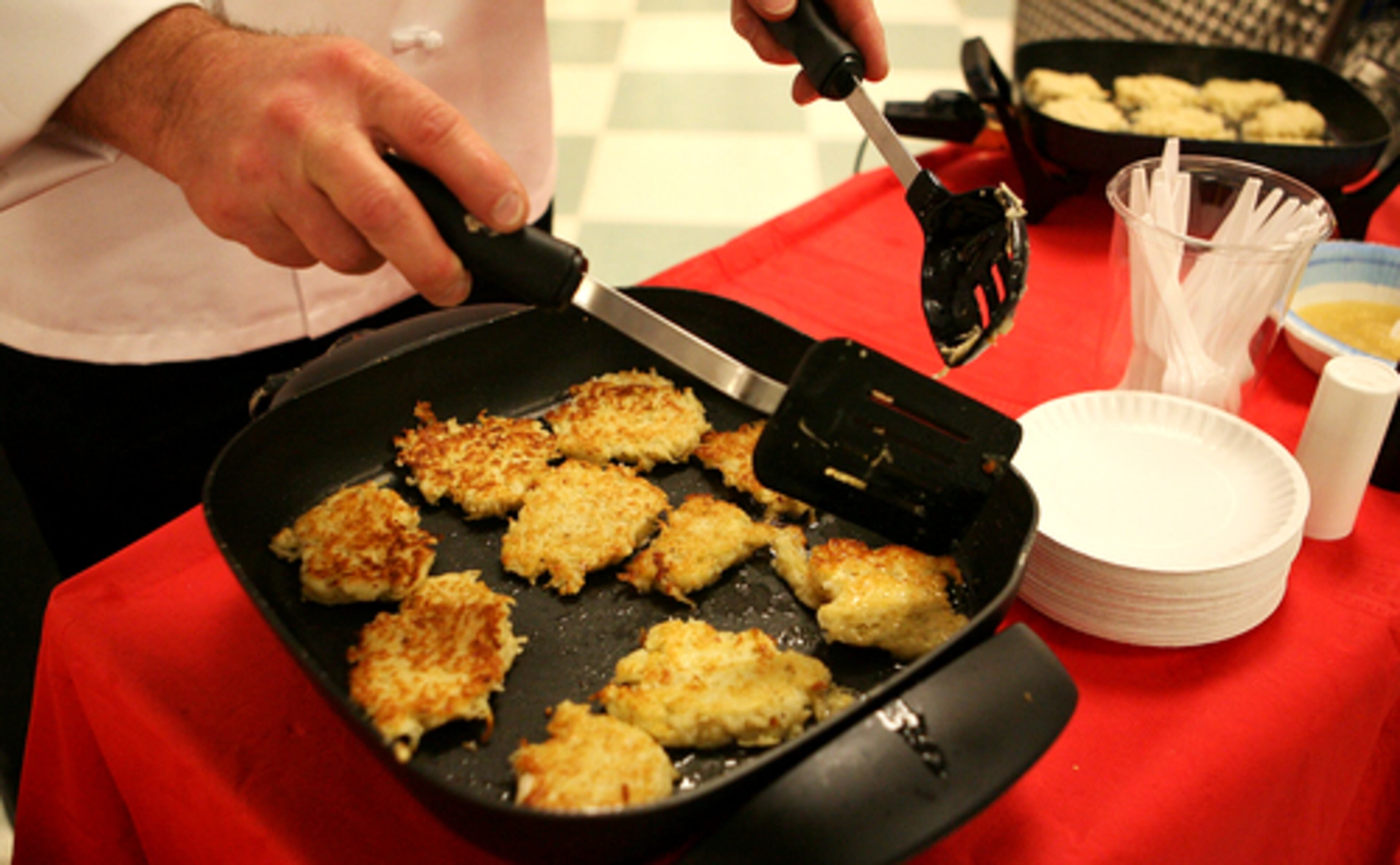 The Hanukkah celebration at the Toco Hills Kroger included two stations that were churning out potato pancakes.