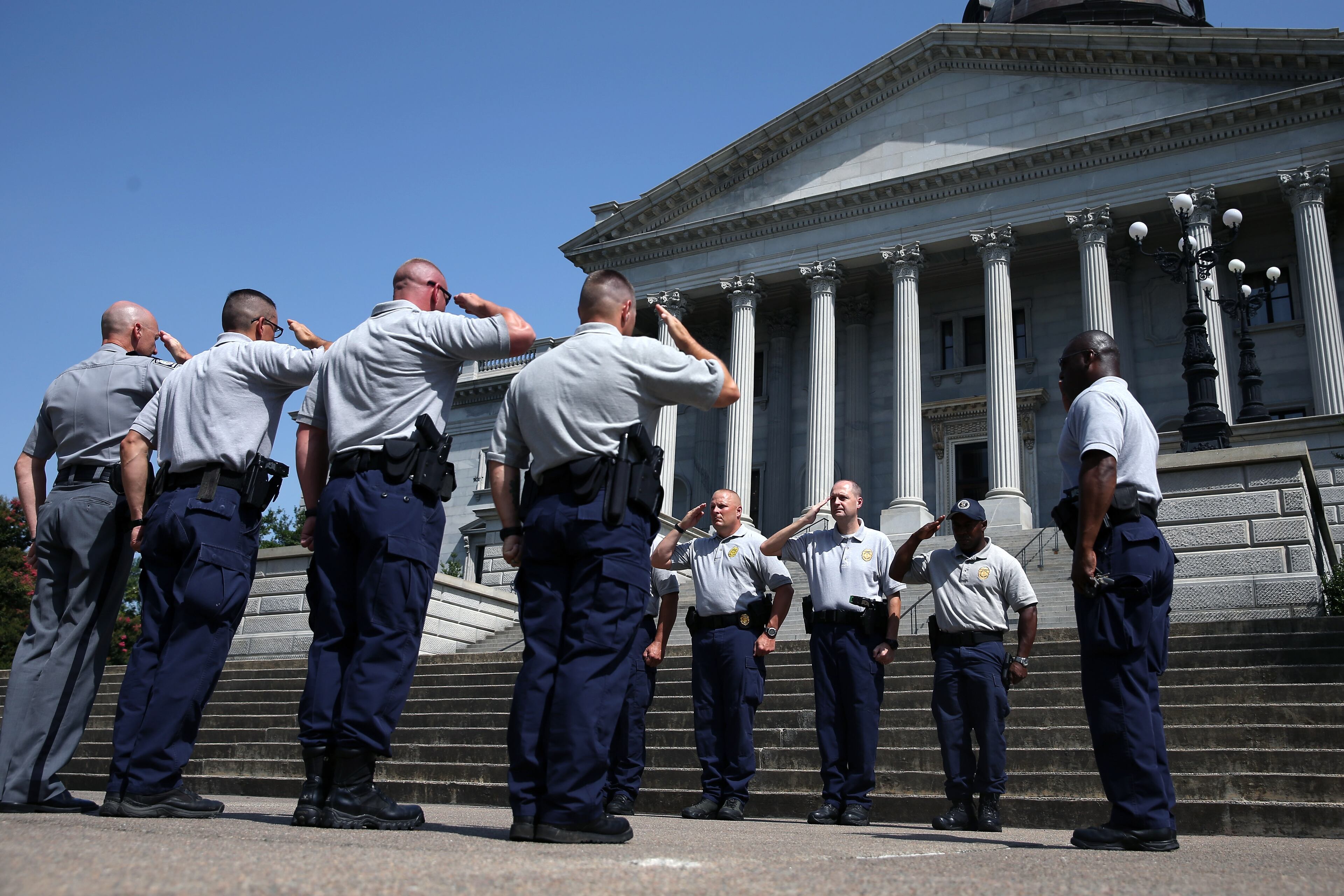 COLUMBIA, SC - JUNE 24: South Carolina Highway Patrol Honor Guard rehearse for the arrival of the coffin of church pastor and South Carolina State Sen. Clementa Pinckney to lie in the Statehouse Rotunda on June 24, 2015 in Columbia, South Carolina. Pinckney was one of nine people killed during a Bible study inside Emanuel AME church in Charleston. U.S. President Barack Obama and Vice President Joe Biden are expected to attend the funeral which is set for Friday June 26 at the TD Arena. (Photo by Joe Raedle/Getty Images)