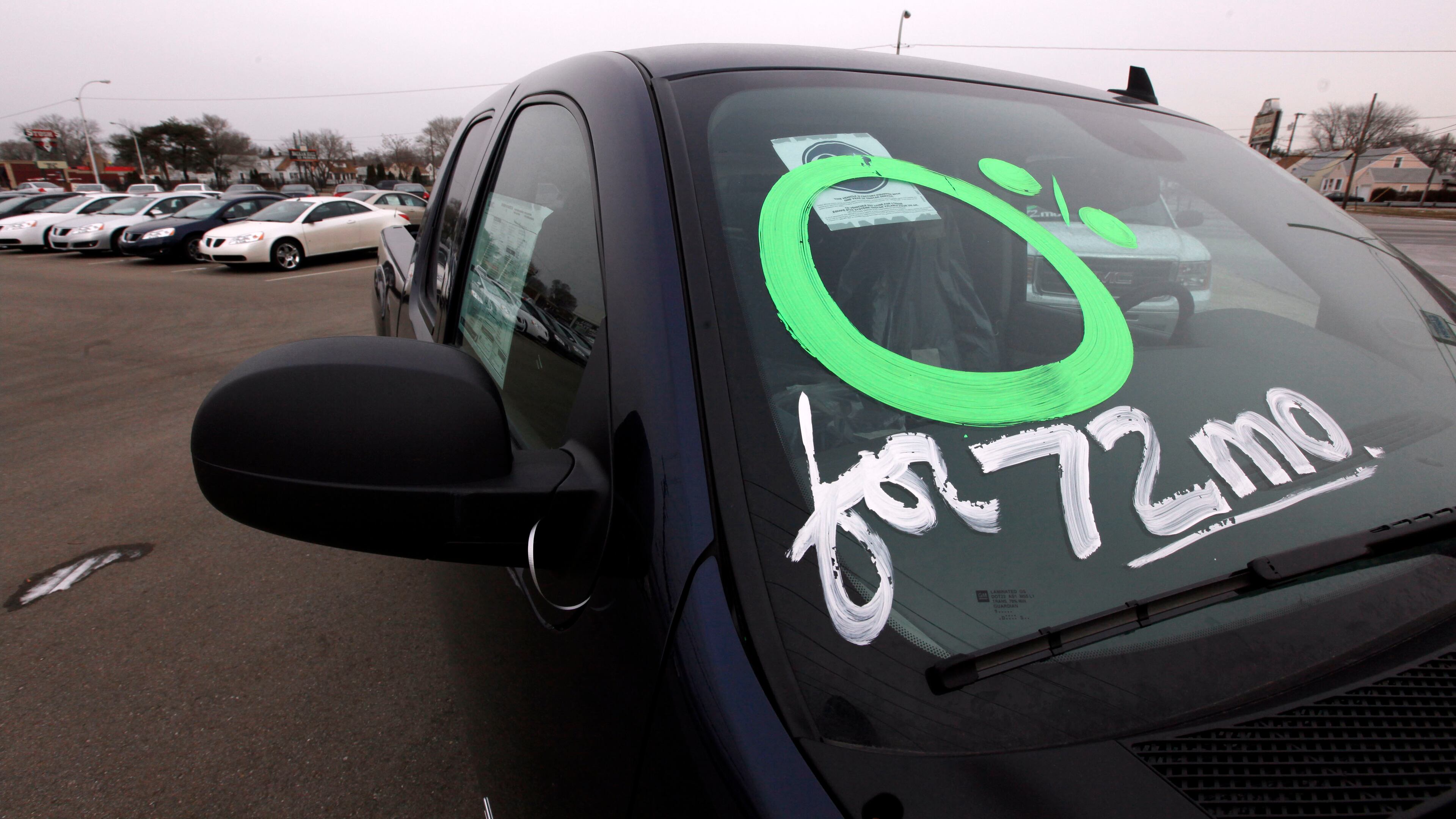 FILE - In this Feb. 1, 2010 file photo, 0 percent financing for 72 months is advertised on a GMC Sierra pickup truck at a dealership in Center Line, Mich. When a car dealer offers to loan you the money to buy a car at zero interest, it gets your attention. Yet that cheap money might not be the best deal you can get. (AP Photo/Paul Sancya, File)