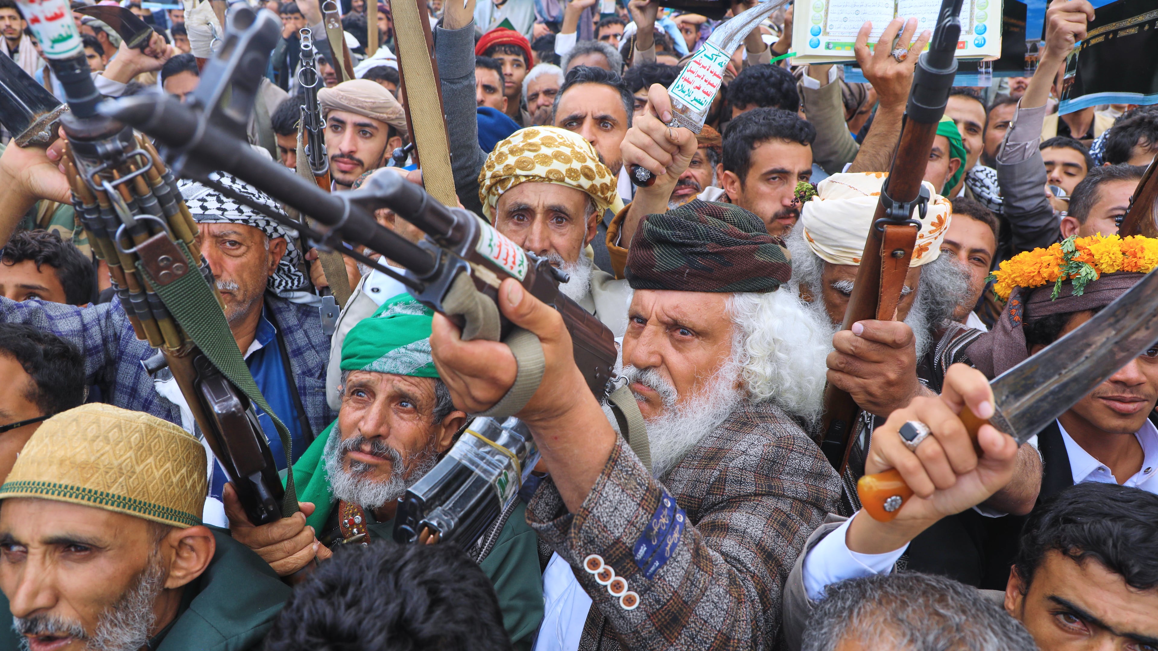 Supporters of Yemen's Houthi rebels raise their rifles during a rally in support of the group and to protest Saudi Arabia's accusation that the Houthis targeted Islam's holiest site of Mecca, in Sanaa, Yemen, Friday, Sept. 18, 2026. (AP Photo/Osamah Abdulrahman)