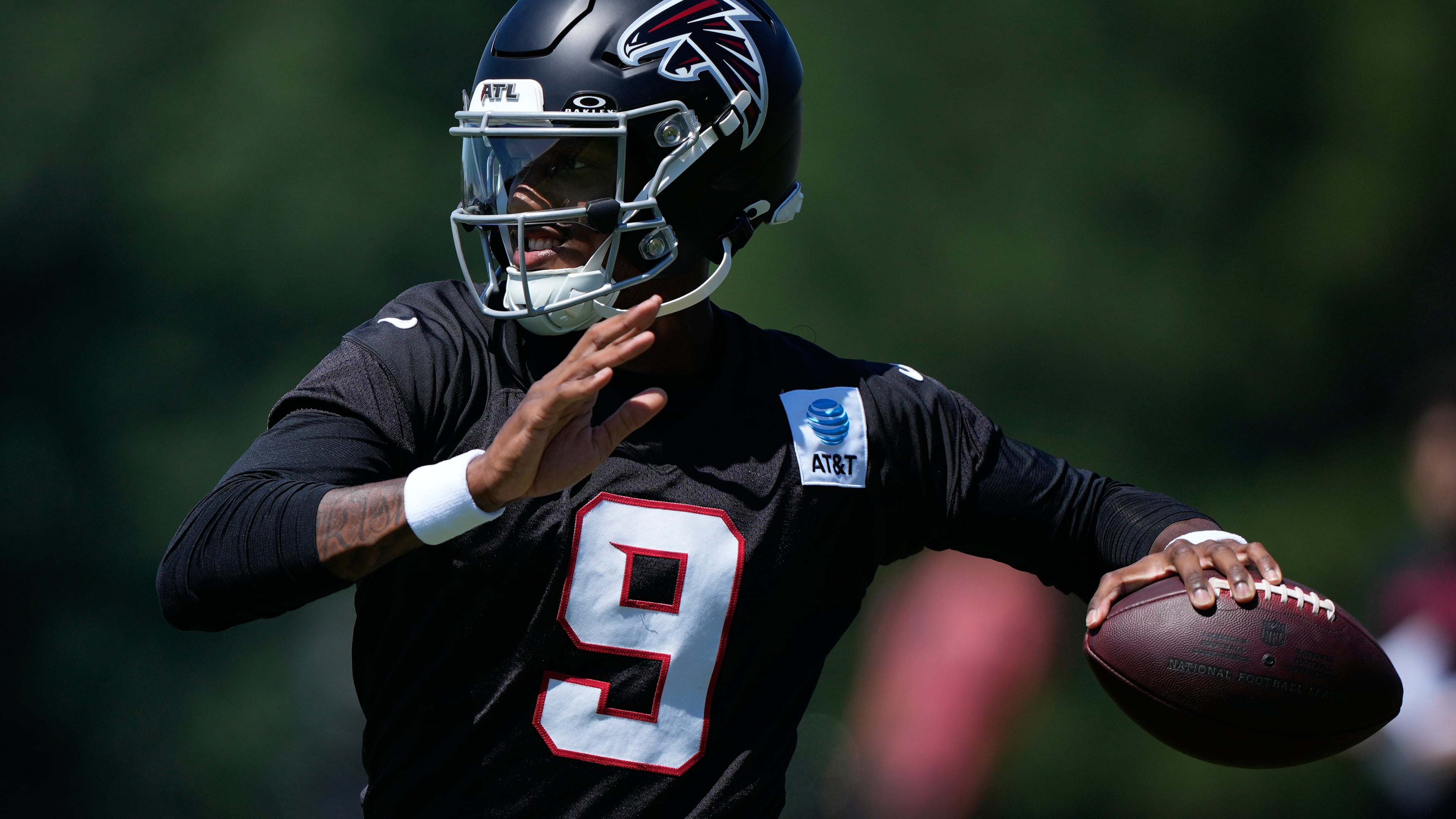 Atlanta Falcons quarterback Michael Penix Jr. (9) runs drills during an NFL football training camp practice Monday, Aug. 24, 2026, in Flowery Branch, Ga. (AP Photo/Brynn Anderson)