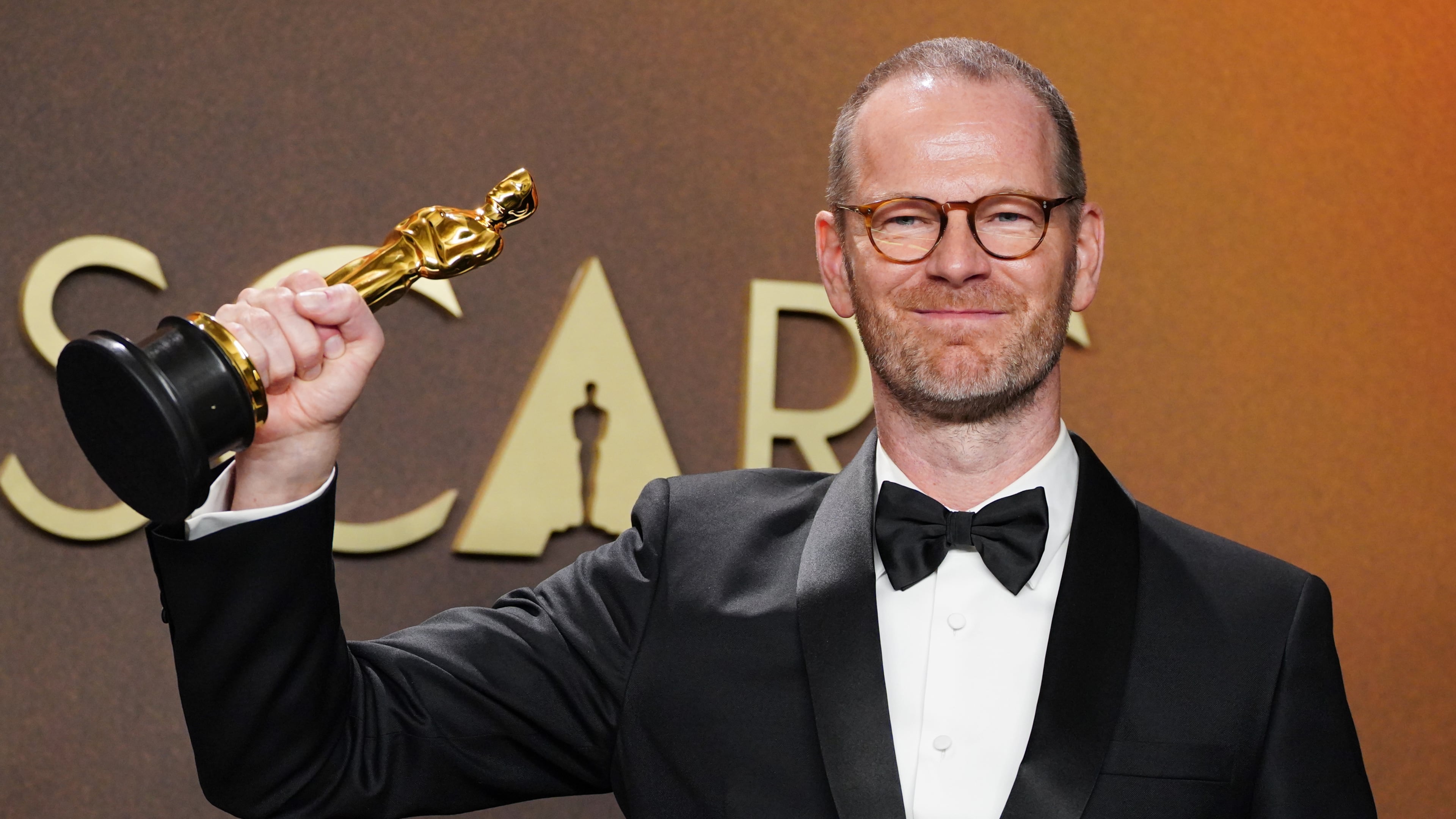 Joachim Trier, winner of the award for international feature film for "Sentimental Value," poses in the press room at the Oscars on Sunday, March 15, 2026, at the Dolby Theatre in Los Angeles. (Photo by Jordan Strauss/Invision/AP)
