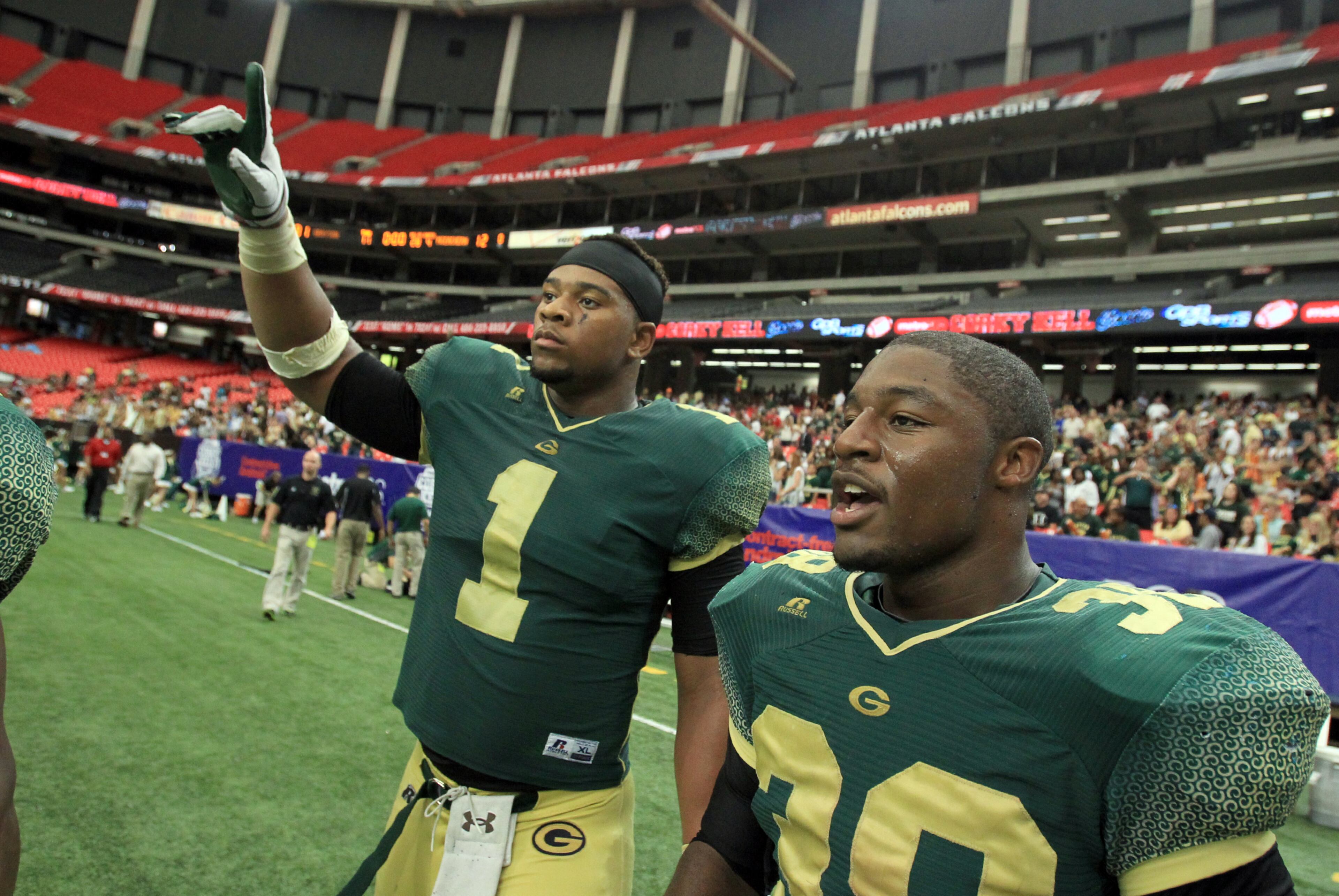 Grayson defensive end/running back Robert Nkemdiche (left) and linebacker Jay Strickland celebrate their 31-12 win over McEachern.l