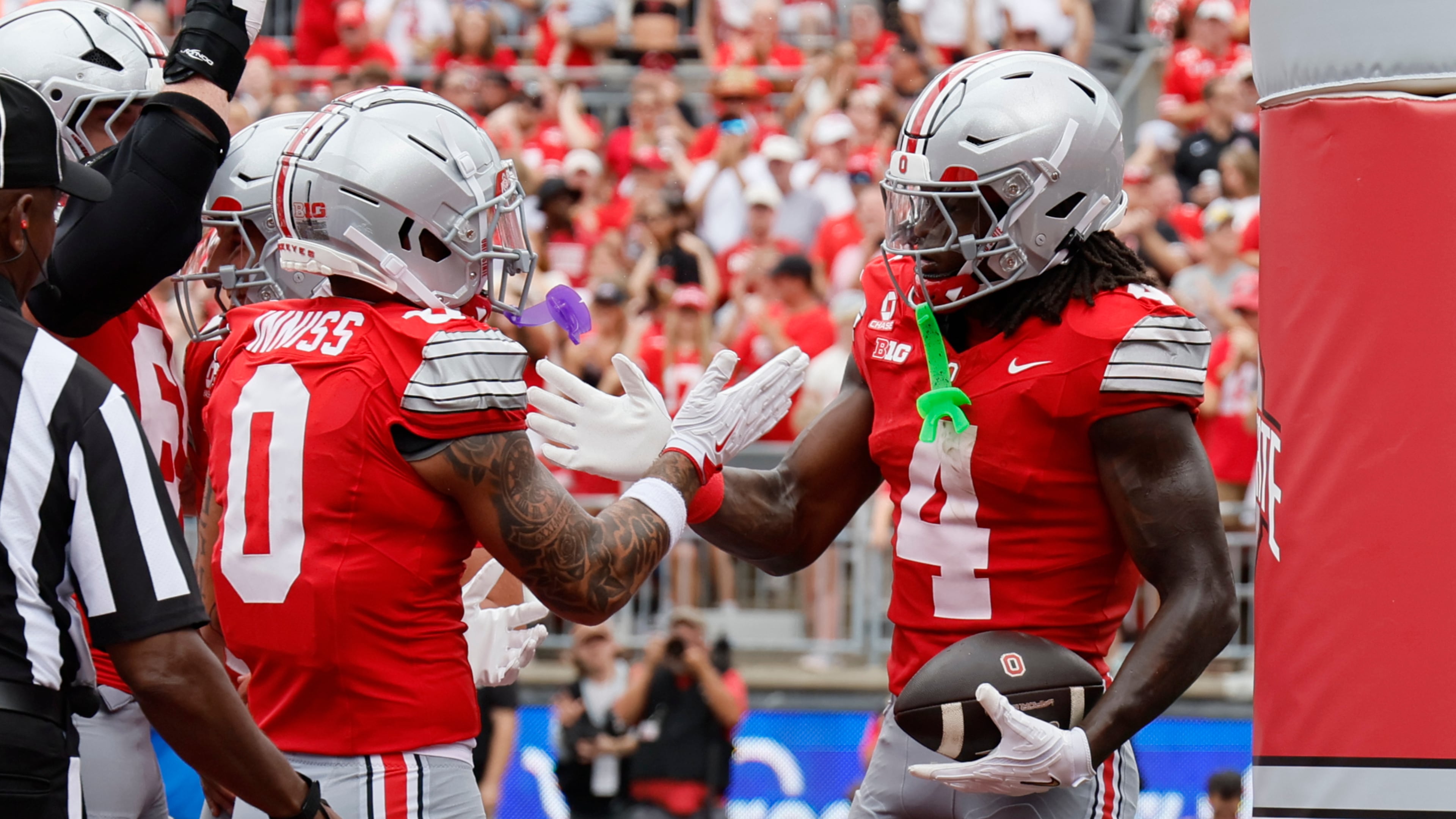 Ohio State wide receiver Jeremiah Smith, right, celebrates his touchdown reception against Ball State with teammate Brandon Inniss during the first half of an NCAA college football game, Saturday, Sept. 5, 2026, in Columbus, Ohio. (AP Photo/Jay LaPrete)