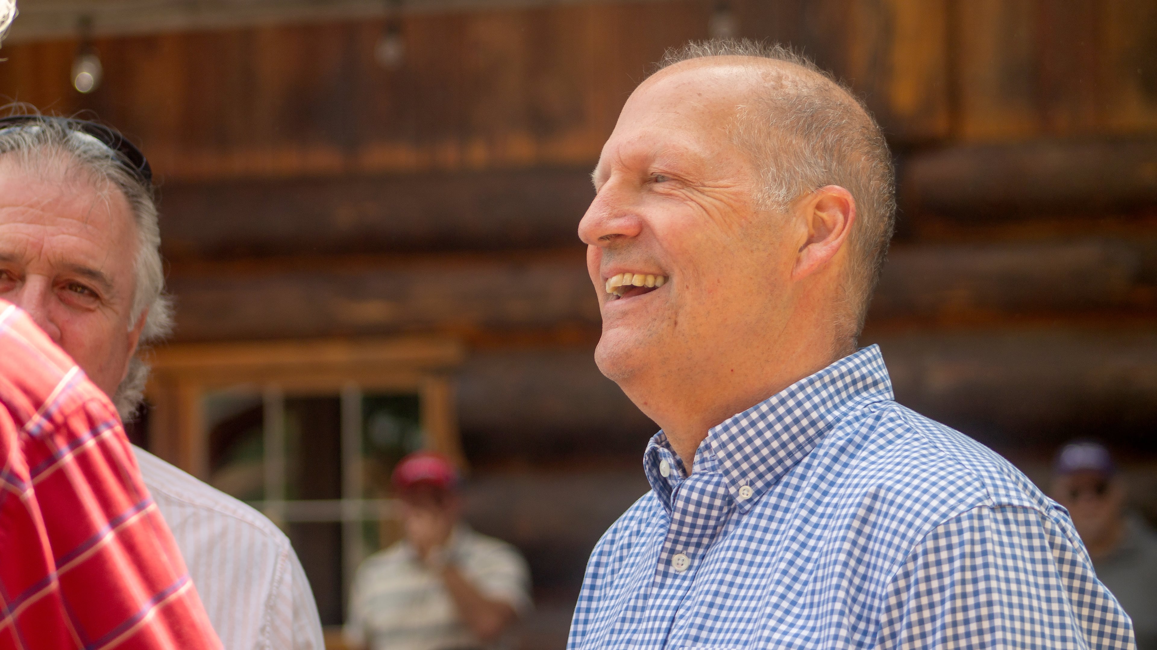 Former Sen. John E. Sununu, who is running for his old seat nearly 18 years after being ousted, mingles with voters at the Coos County Republican Committee BBQ in Berlin, N.H., Saturday, Aug. 22, 2026. (AP Photo/Holly Ramer)