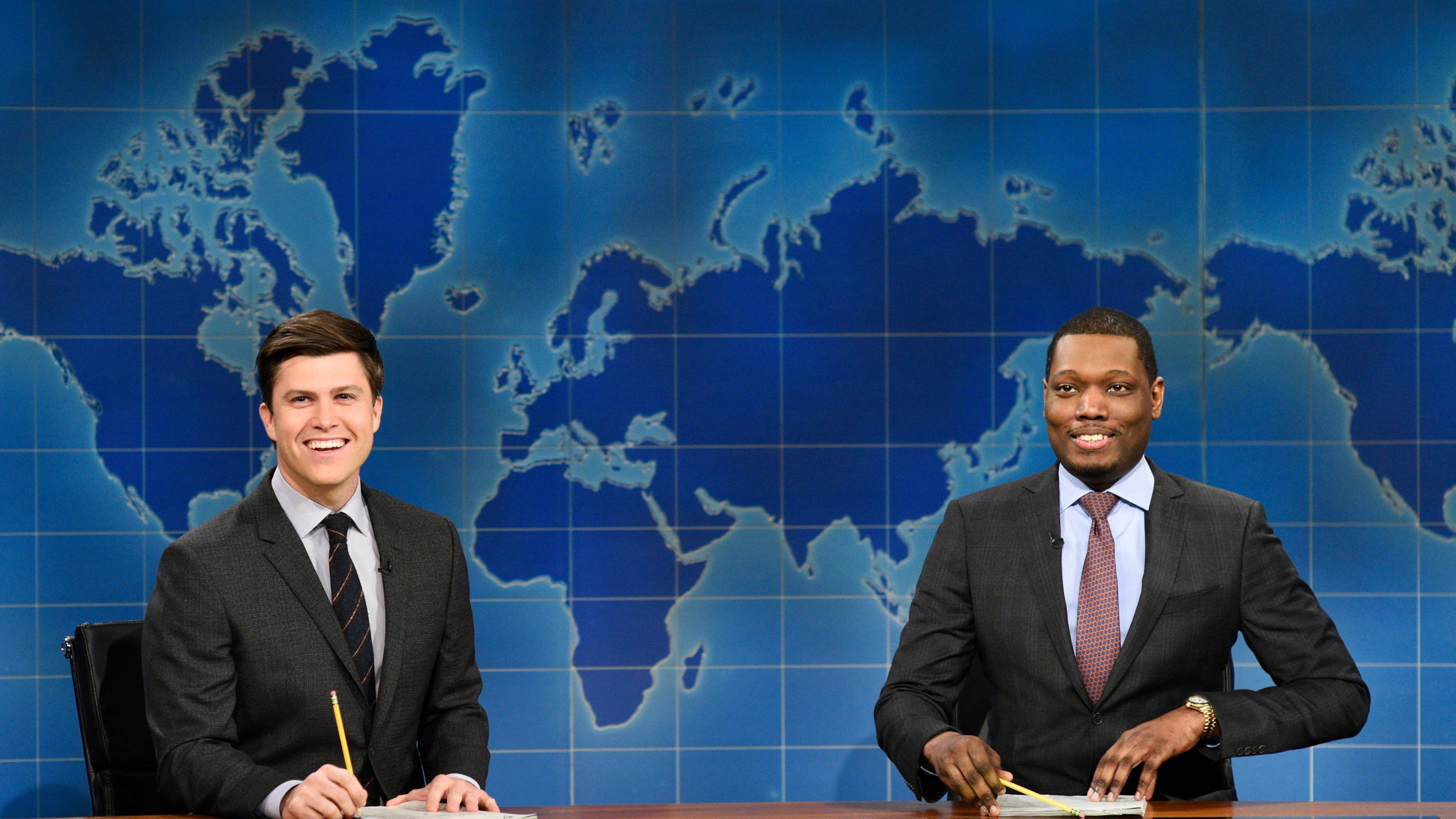 In this March 4, 2017 photo provided by NBC, Colin Jost and Michael Che, right, appear during Weekend Update segment of "Saturday Night Live" in New York. "Saturday Night Live" will broadcast live simultaneously across the U.S. for its final four shows of the season, NBC announced Thursday, March 16. (Will Heath/NBC via AP)