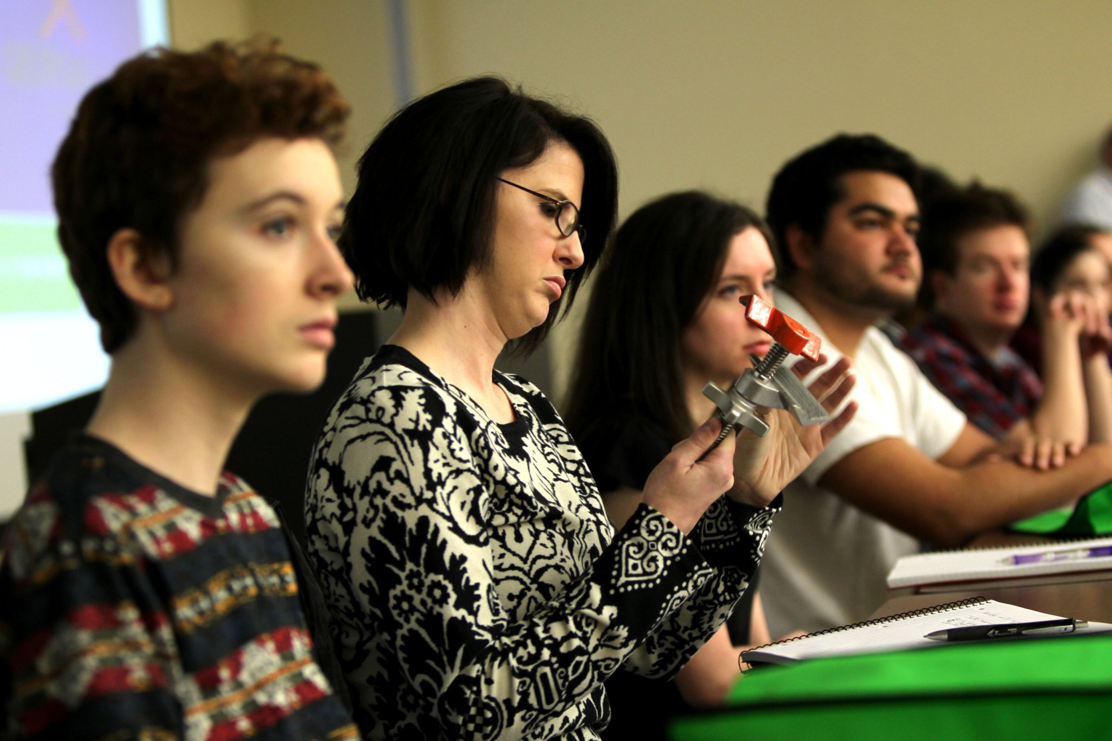 Laura Hofer, 31, inspects a piece of equipment during the on-set film production class at Gwinnett Technical College. The class is part of the Georgia Film Academy Certificate Program that will prepare students for on-set jobs in the film industry. TAYLOR CARPENTER / TAYLOR.CARPENTER@AJC.COM