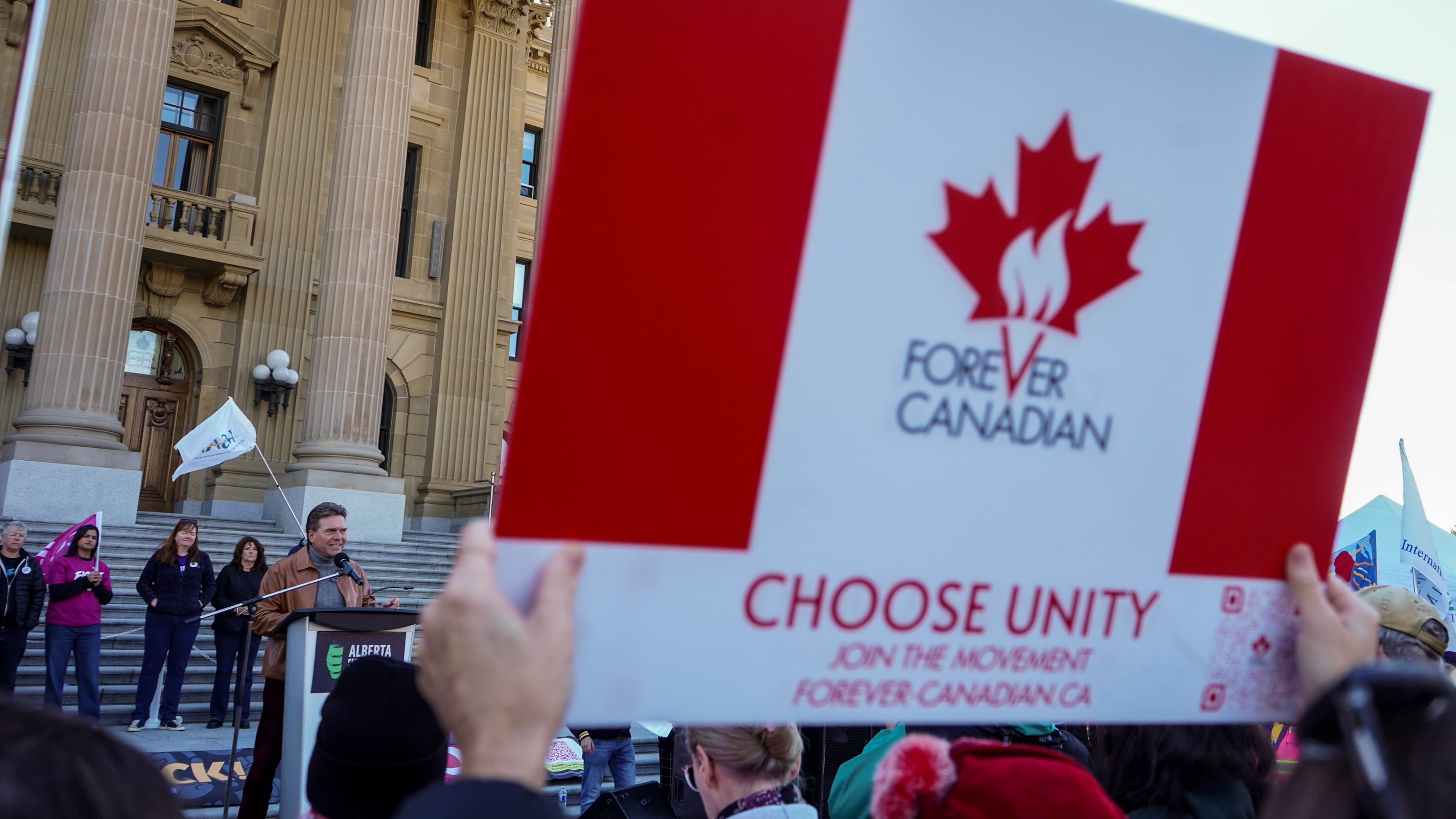 Forever Canada leader Thomas Lukaszuk, left, gives a speech during a pro-Canada rally in Edmonton, Alberta, Sunday, Oct, 18, 2026. (Timon Johnson/The Canadian Press via AP)