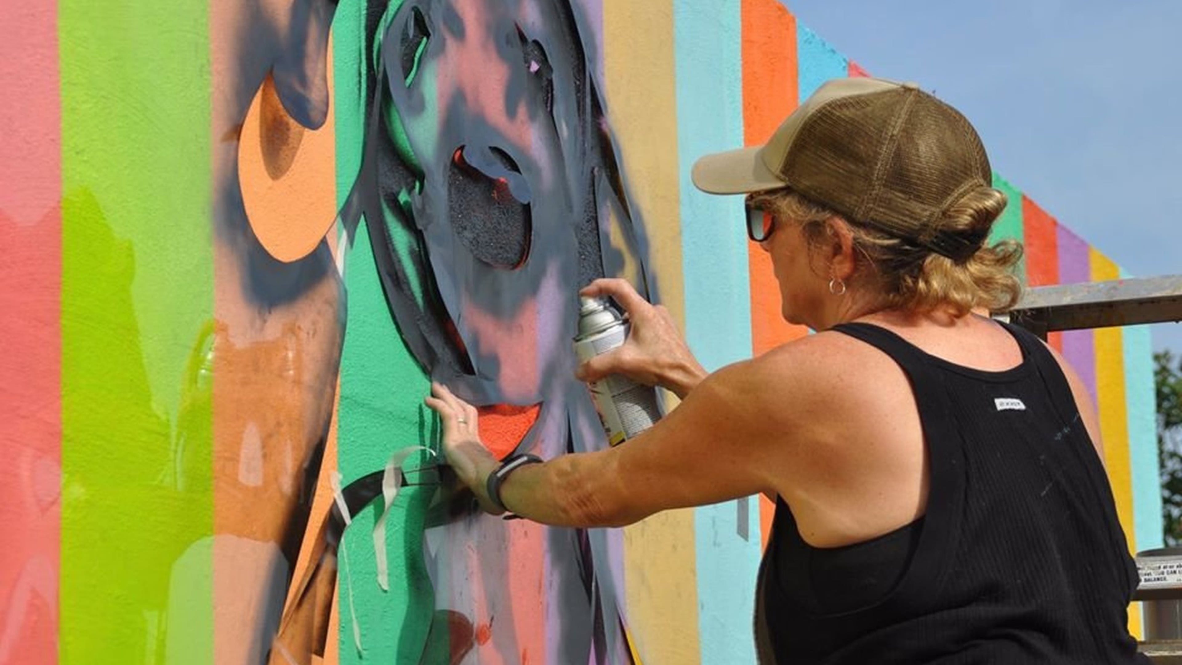 Artist Linda Mitchell finishes her painting on a skatepark wall along the Atlanta Beltline. Days later, her work was ravaged by people who were not fans.