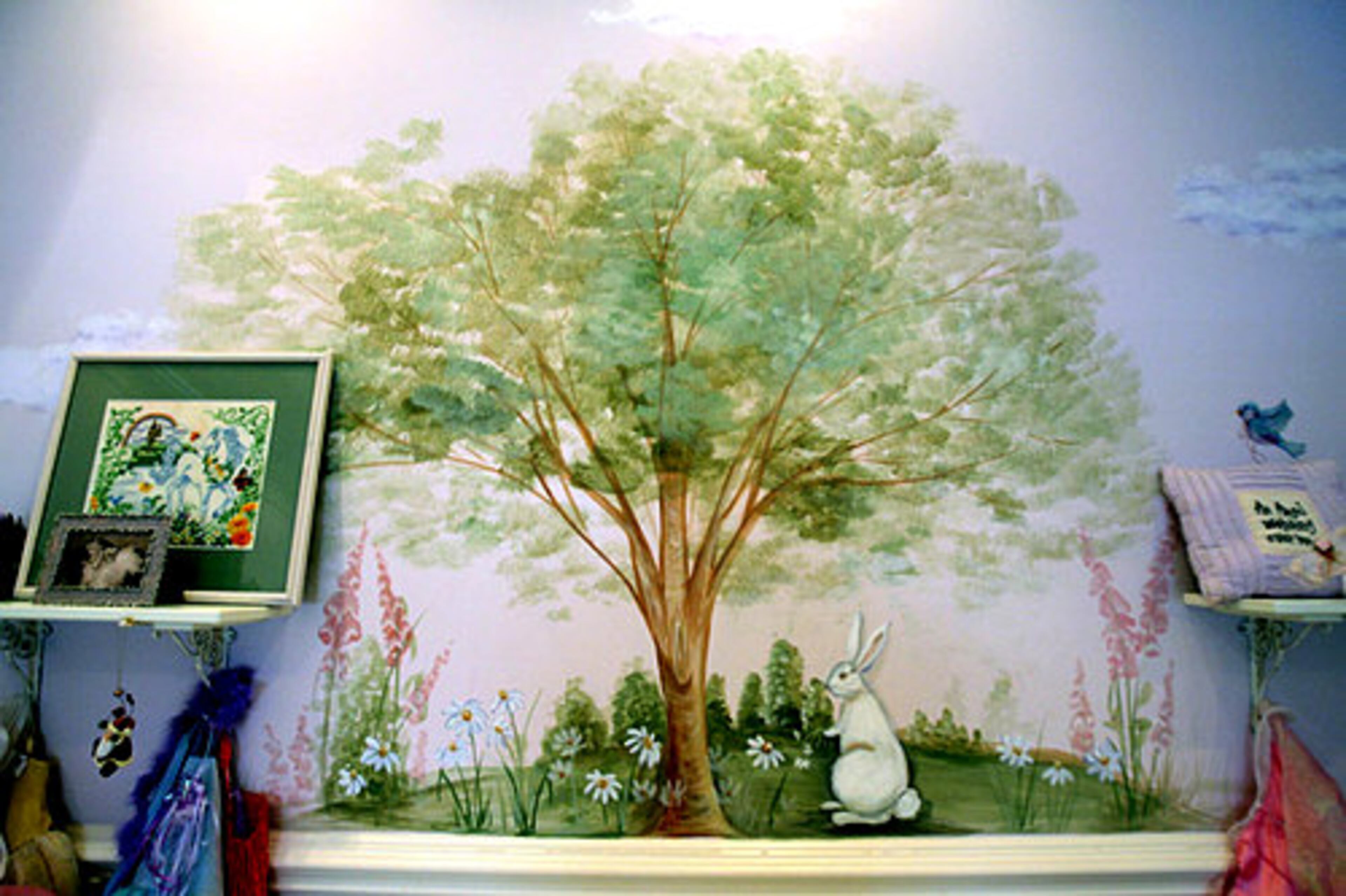 A hand-painted mural by Mendy Dunigan Design adds a touch of whimsy.