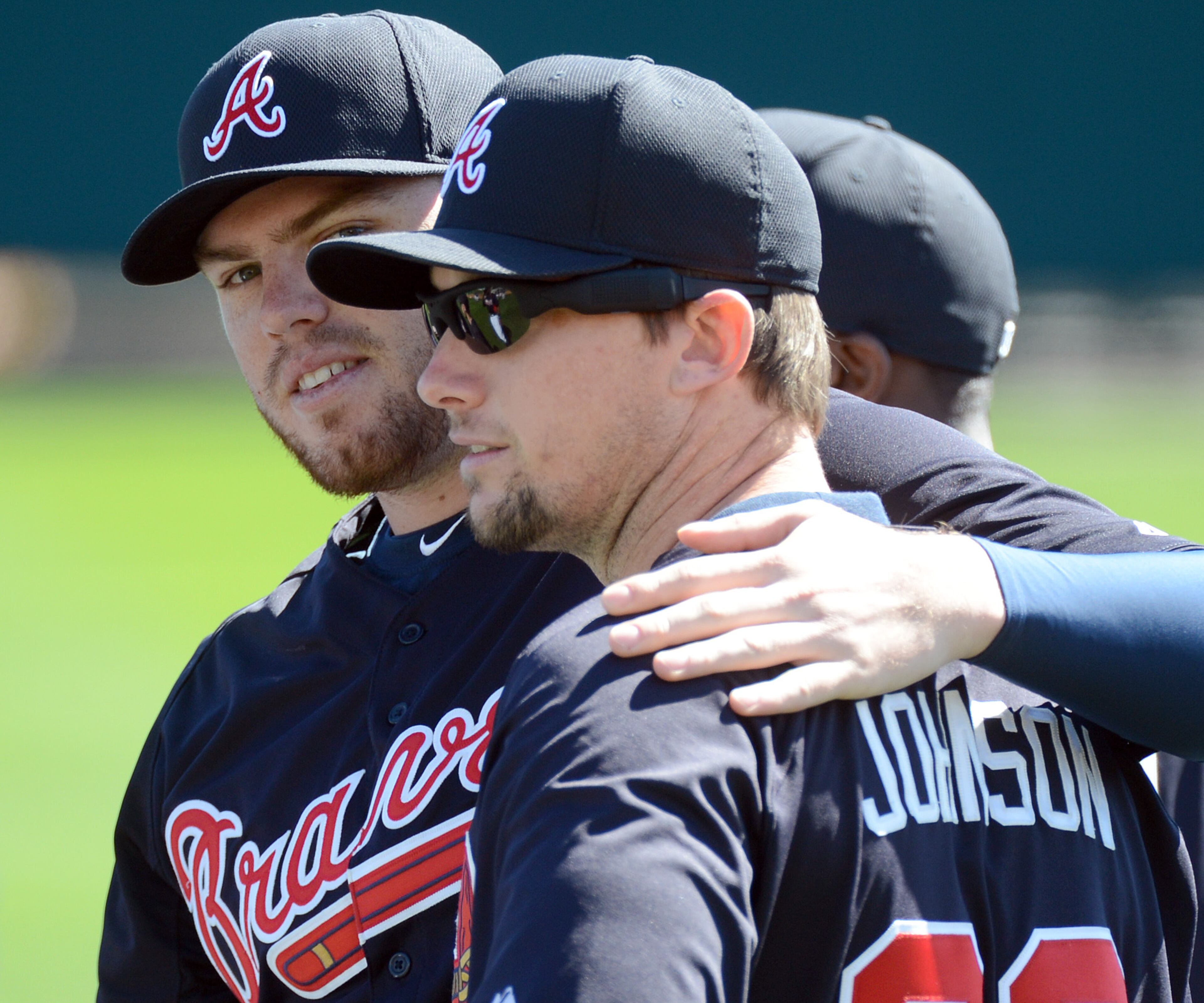 February 17, 2013 Lake Buena Vista, Fl: Atlanta Braves infielder Freddie Freeman (left) puts his arm around Atlanta Braves infielder Chris Johnson during the third full squad workout at Champion Stadium in the ESPN Wide World of Sports Complex in Lake Buena Vista, Fl., on Sunday, Feb. 17, 2013. HYOSUB SHIN / HSHIN@AJC.COM
