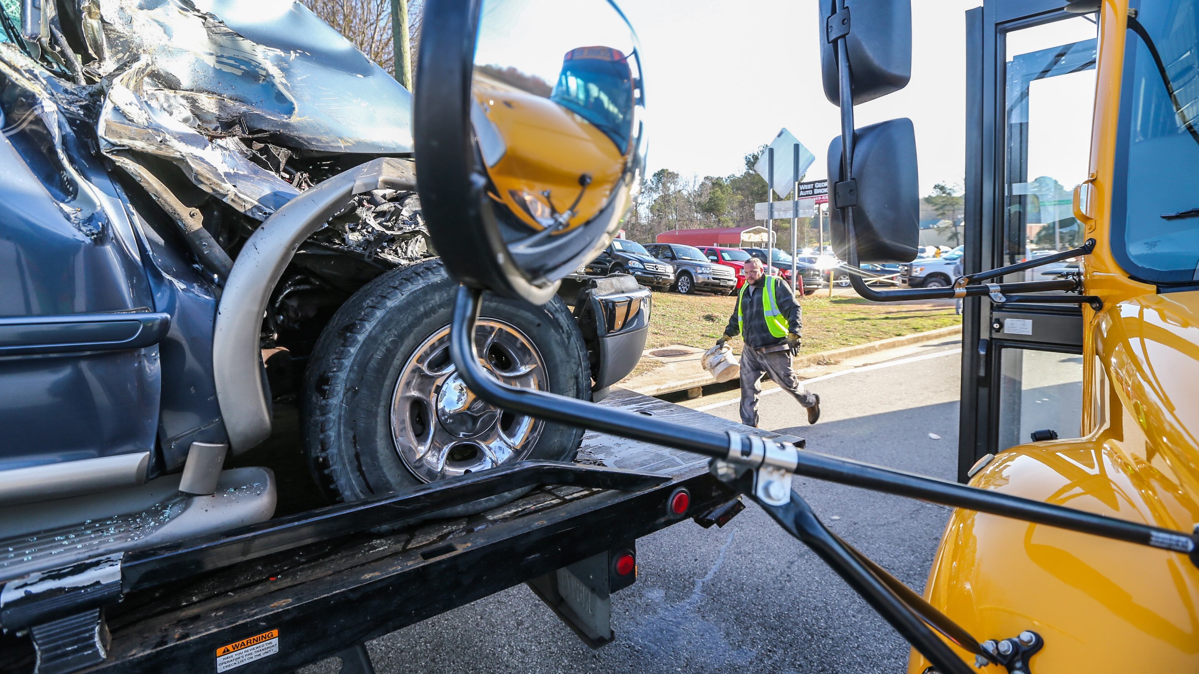 An SUV struck a school bus Friday in Douglas County. JOHN SPINK / JSPINK@AJC.COM