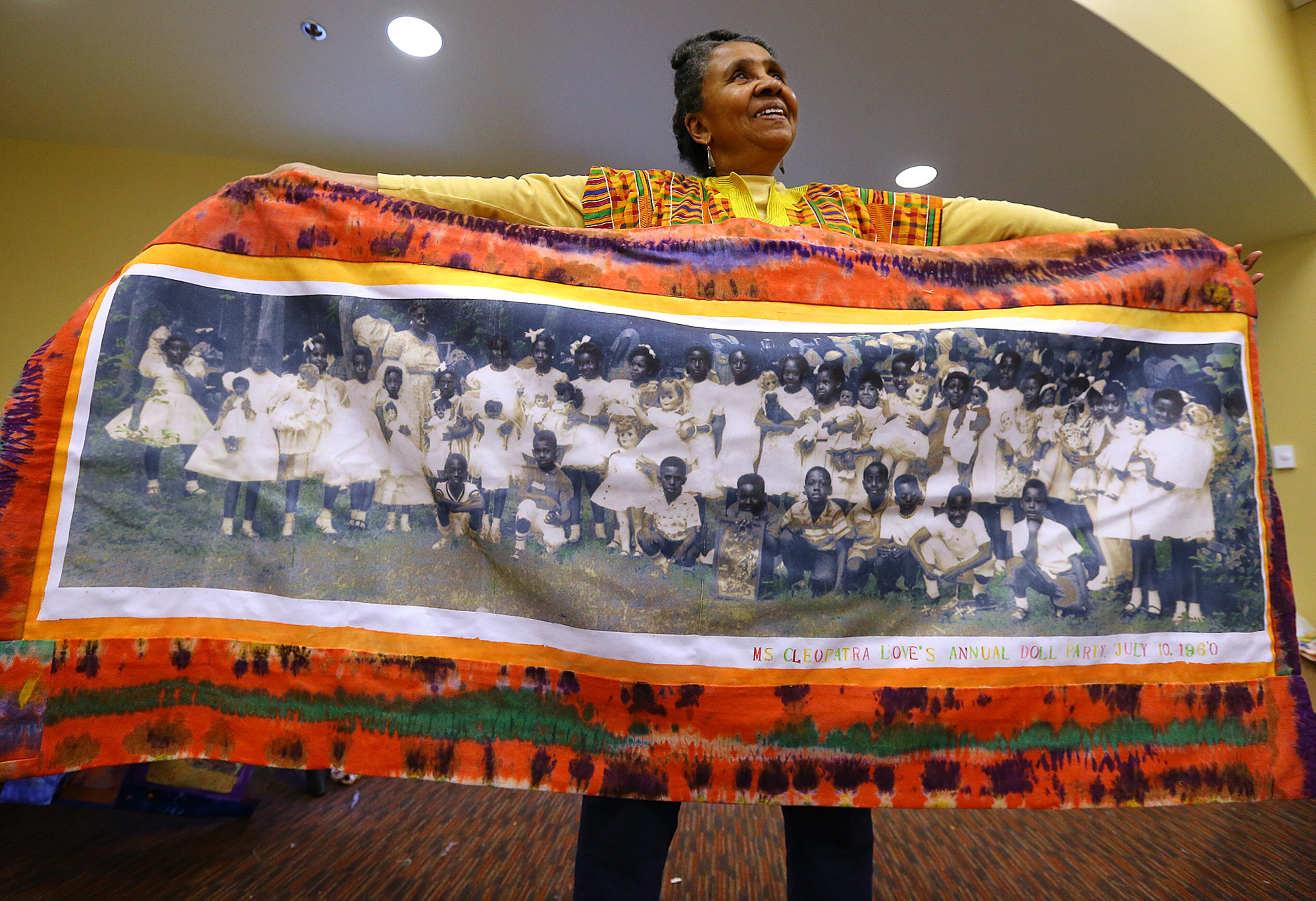 Textile designer Wini McQueen shows off a piece of tapestry she is integrating into three large panels that will circle the rotunda in a display called “If Walls Could Talk” at the Tubman Museum of African American Art, History and Culture on Wednesday, May 6, 2015, in Macon. Curtis Compton / ccompton@ajc.com Read about the Tubman Museum's expansion