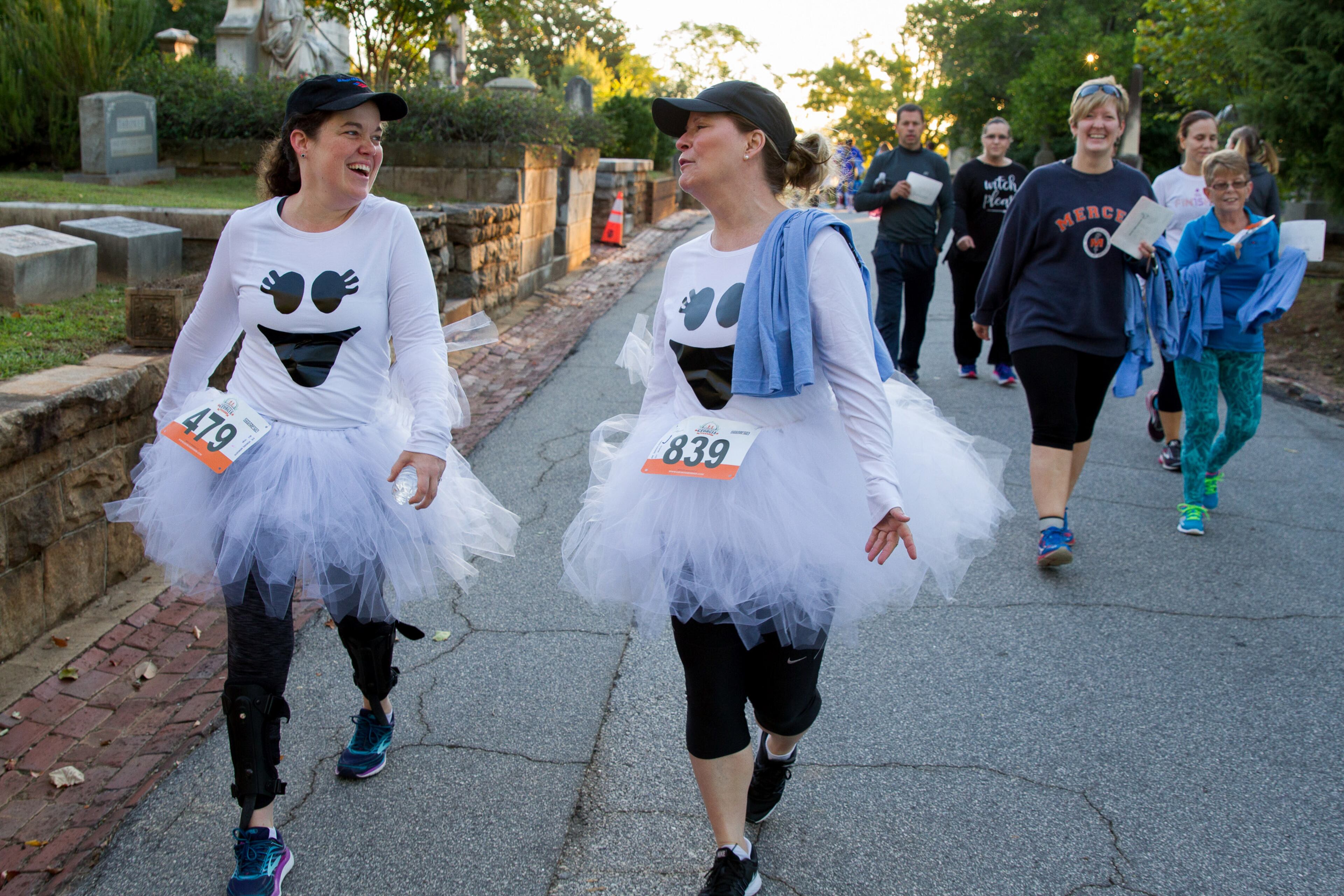 Meredith Howard (L) and Karen Rariden get ready to run the 11th annual Run Like Hell 5K in the Historic Oakland Cemetery Saturday, October 13, 2018. All proceeds go to the restoration and preservation of the Cemetery. STEVE SCHAEFER / SPECIAL TO THE AJC