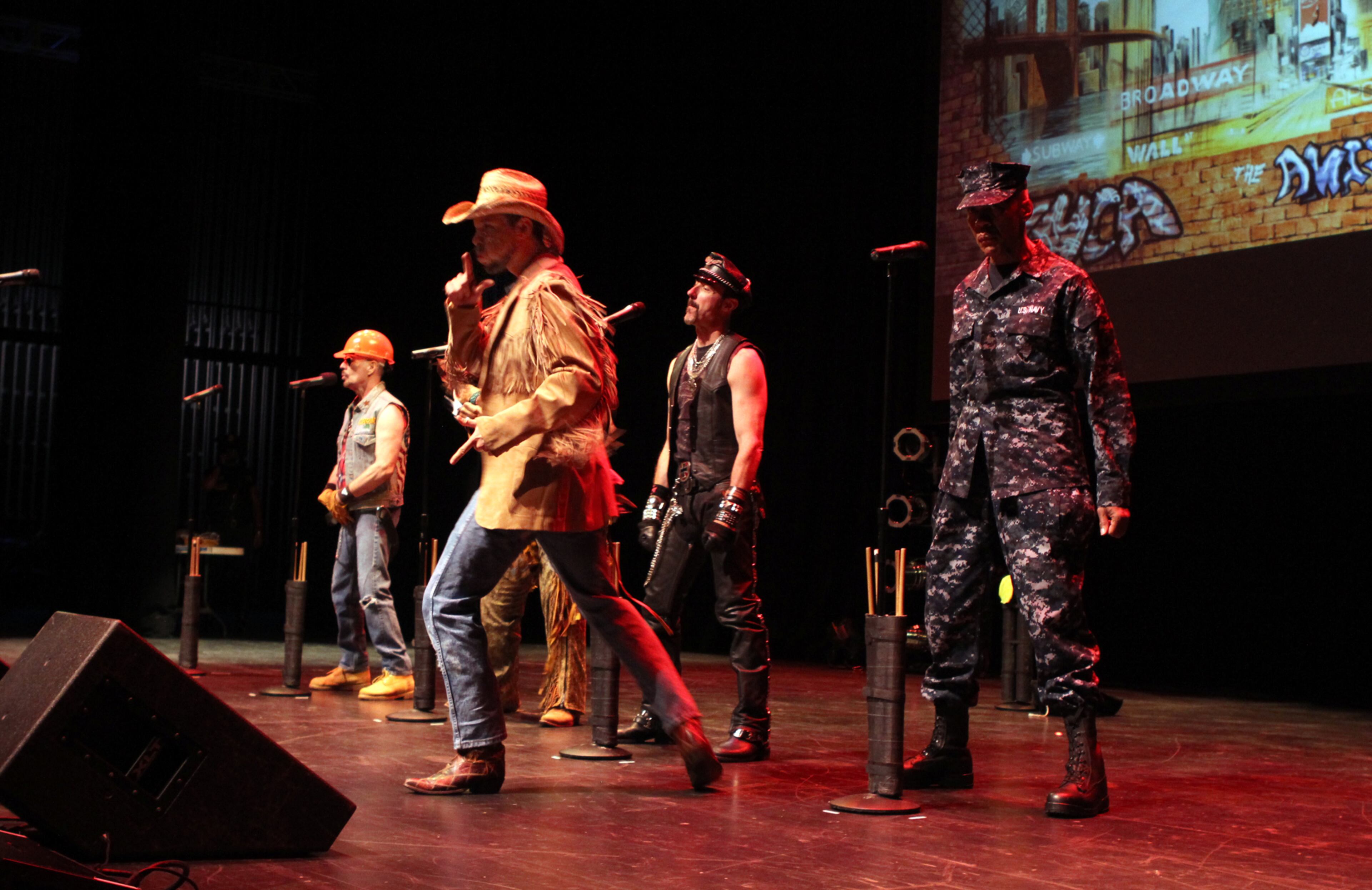 The iconic 70's pop disco group, the Village People, with cowboy Jeff Olson in the foreground as they open their performance with classis, "Gimme Some Lovin,' and "Macho Man," at the Cobb Energy Performance Arts Centre Friday.