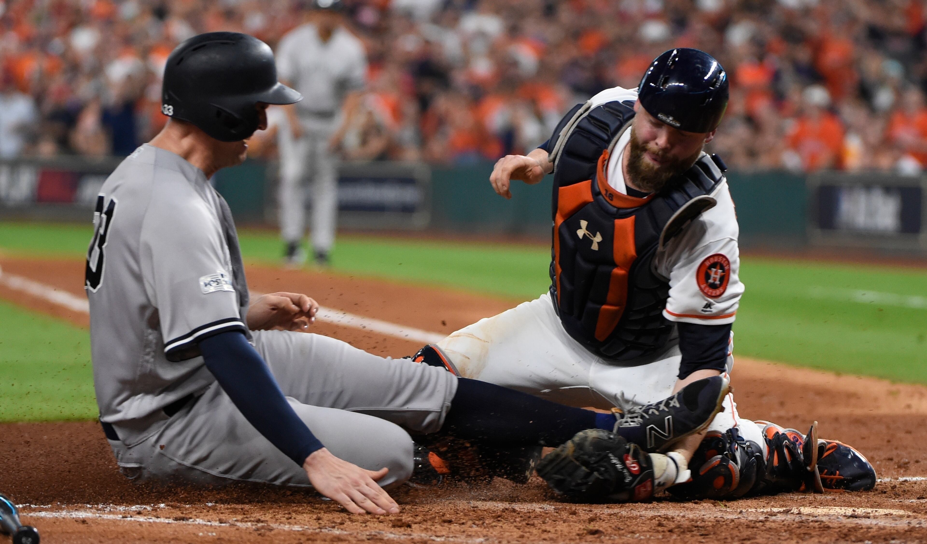 Houston Astros catcher Brian McCann tags out New York Yankees' Greg Bird at home during the fifth inning of Game 7 of baseball's American League Championship Series Saturday, Oct. 21, 2017, in Houston. (AP Photo/Eric Christian Smith)a