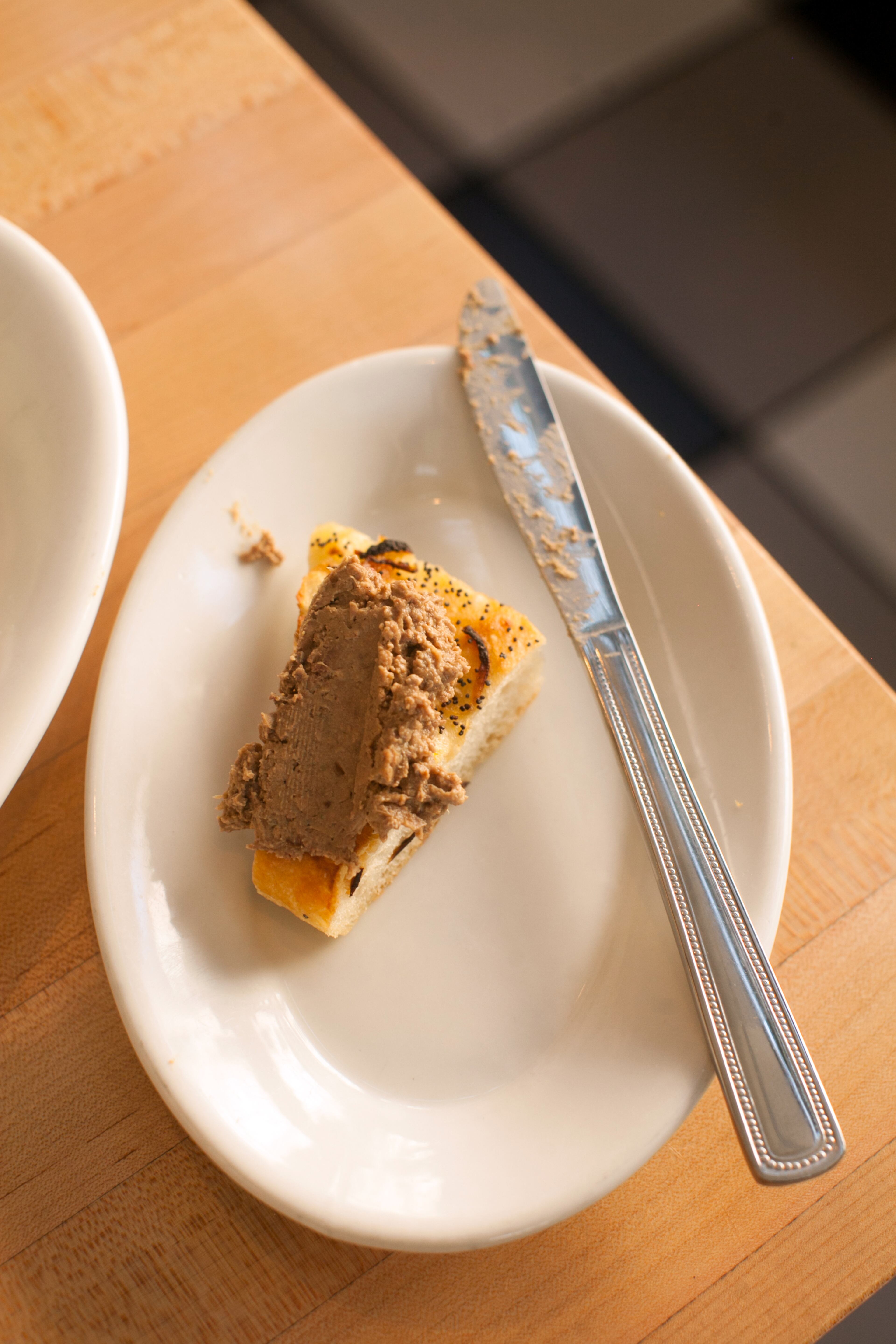 Chef Todd Ginsberg's Chopped Liver spread on a piece of pletzel bread. (styling by Chef Todd Ginsberg) (Photography by Renee Brock/Special)