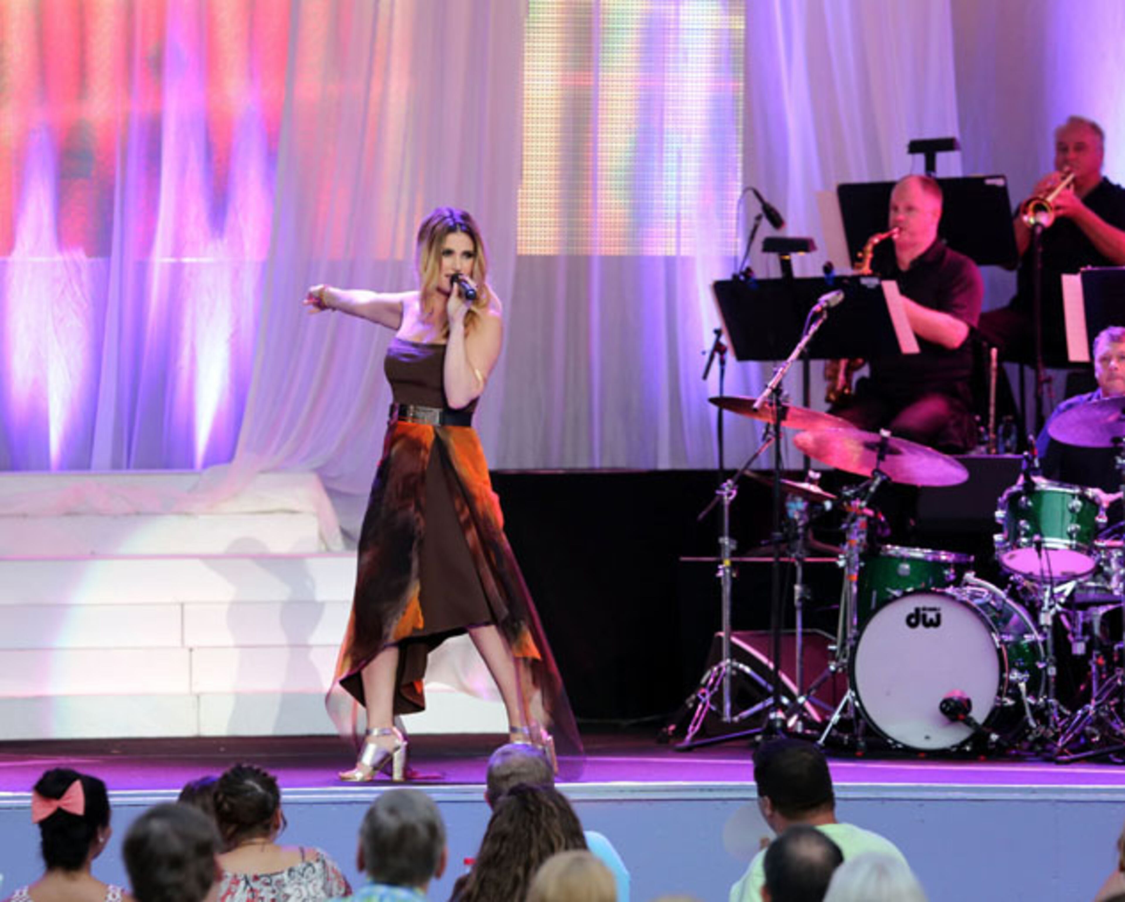 Actress and singer Idina Menzel entertained a large crowd At Chastain Park on Friday night, July 24, 2015. Known for her roles on Broadway in "Rent" and "Wicked". Menzel also was a member of the cast in the TV series "Glee", portraying Skelby Corcoran. The Tony Award winner is recently known for the song "Let It Go" from the film "Frozen." Robb D. Cohen /.RobbsPhotos.com