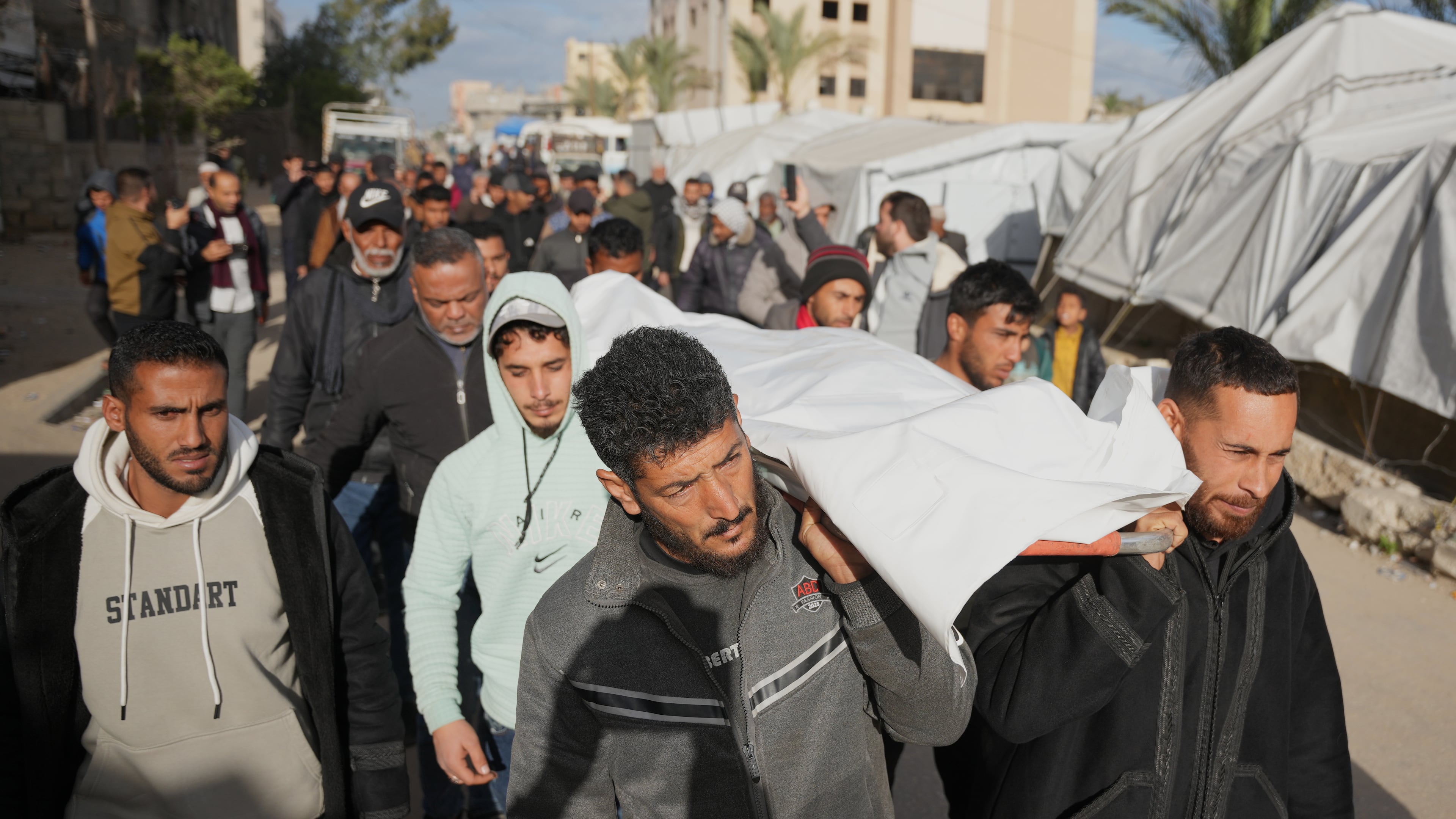 Palestinians carry the body of a man who was killed in an Israeli military strike, during his funeral at Nasser Hospital in Khan Younis , Wednesday, Feb. 4, 2026. (AP Photo/Jehad Alshrafi)