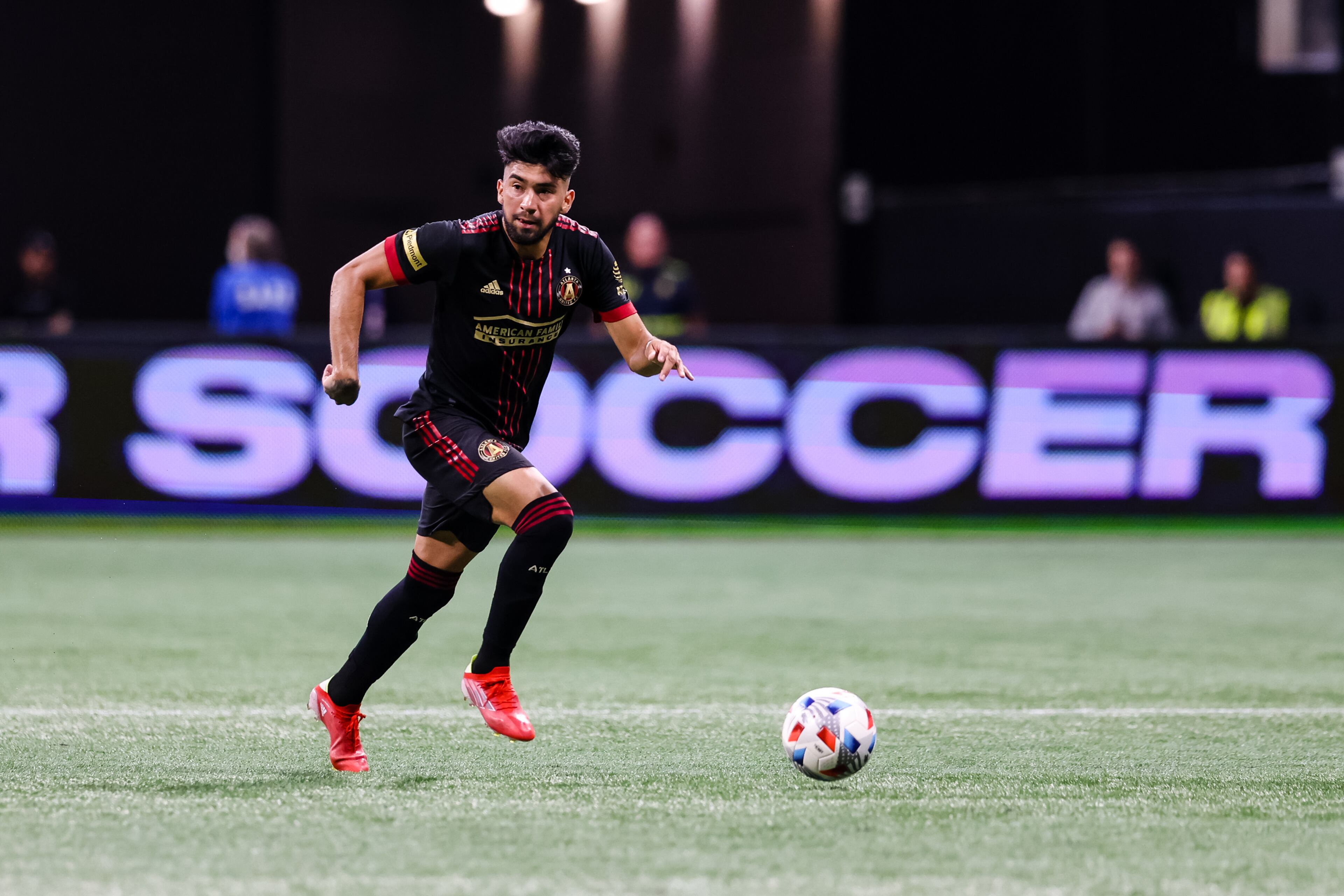 Atlanta United midfielder Marcelino Moreno (10) drives against New England Revolution Saturday, July 17, 2021, at Mercedes-Benz Stadium in Atlanta. (Casey Sykes/Atlanta United)