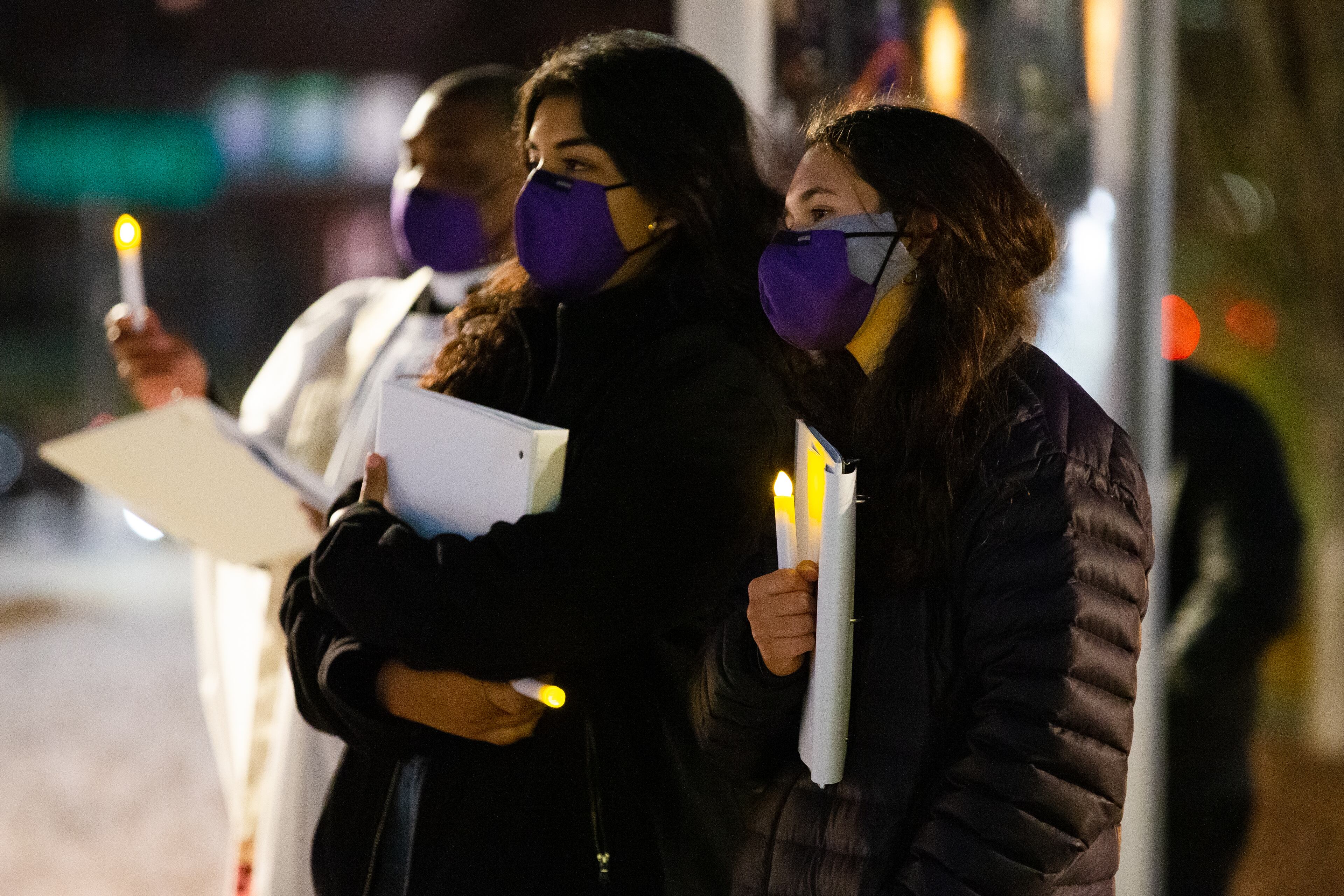 Lucia Fernandez (left), a student from Grady High School, and Katherine Marshall (right), a student from North Druid Hills High School, wait to speak during the vigil on Sunday, January 3, 2021, outside the National Center for Civil and Human Rights in Atlanta. CHRISTINA MATACOTTA FOR THE ATLANTA JOURNAL-CONSTITUTION