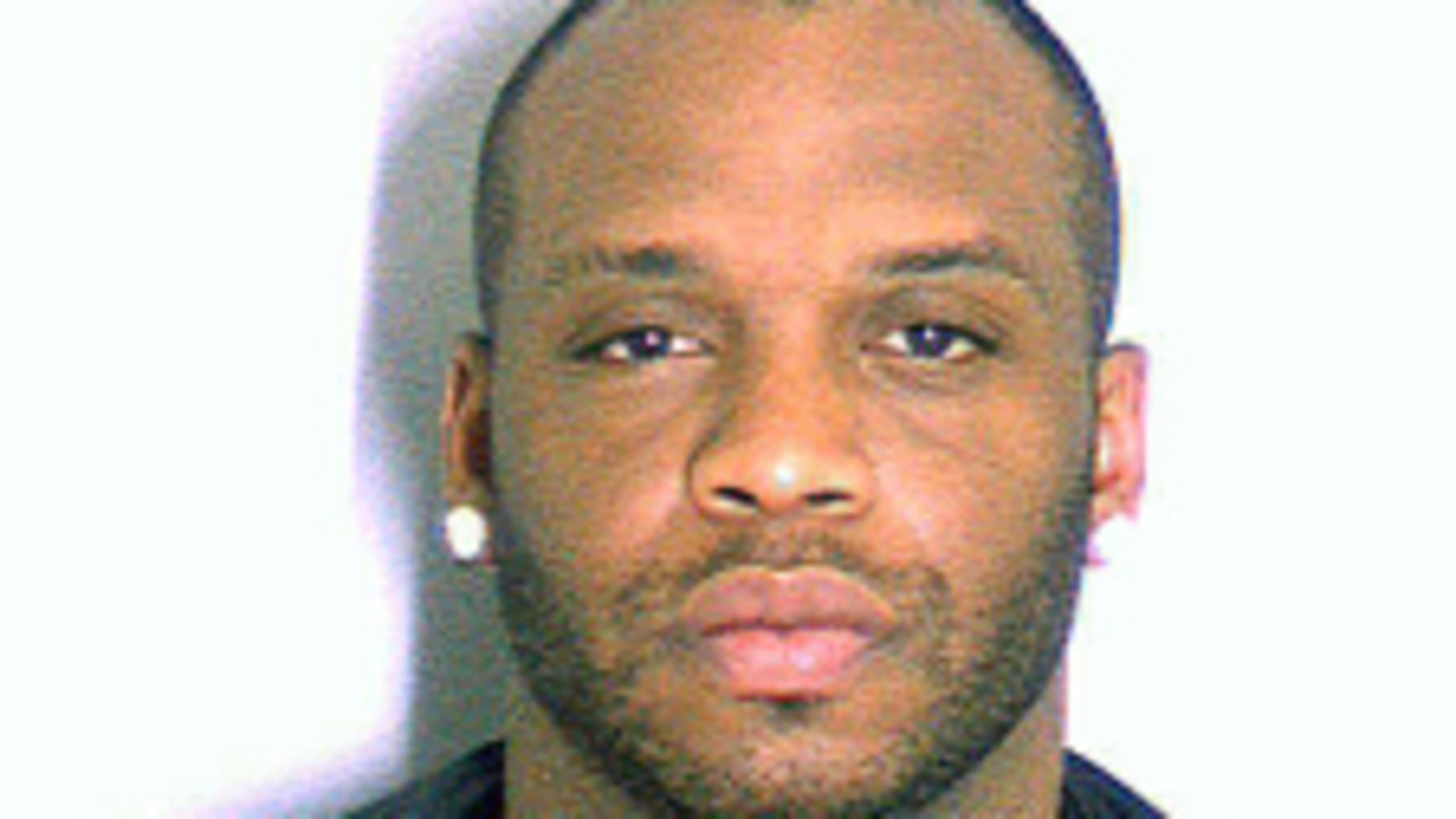 This undated photo provided by the Dekalb County Police, Tuesday, July 29, 2014, shows Arizona Cardinals NFL football player John Abraham. Authorities say the former Atlanta Falcons player, who has been absent from the Arizona Cardinals training camp since Friday, was arrested a month ago in suburban Atlanta. The jail records state that Abraham was charged with driving under the influence involving alcohol; and stopping, standing or parking in a prohibited place. (AP Photo/Dekalb County Police)