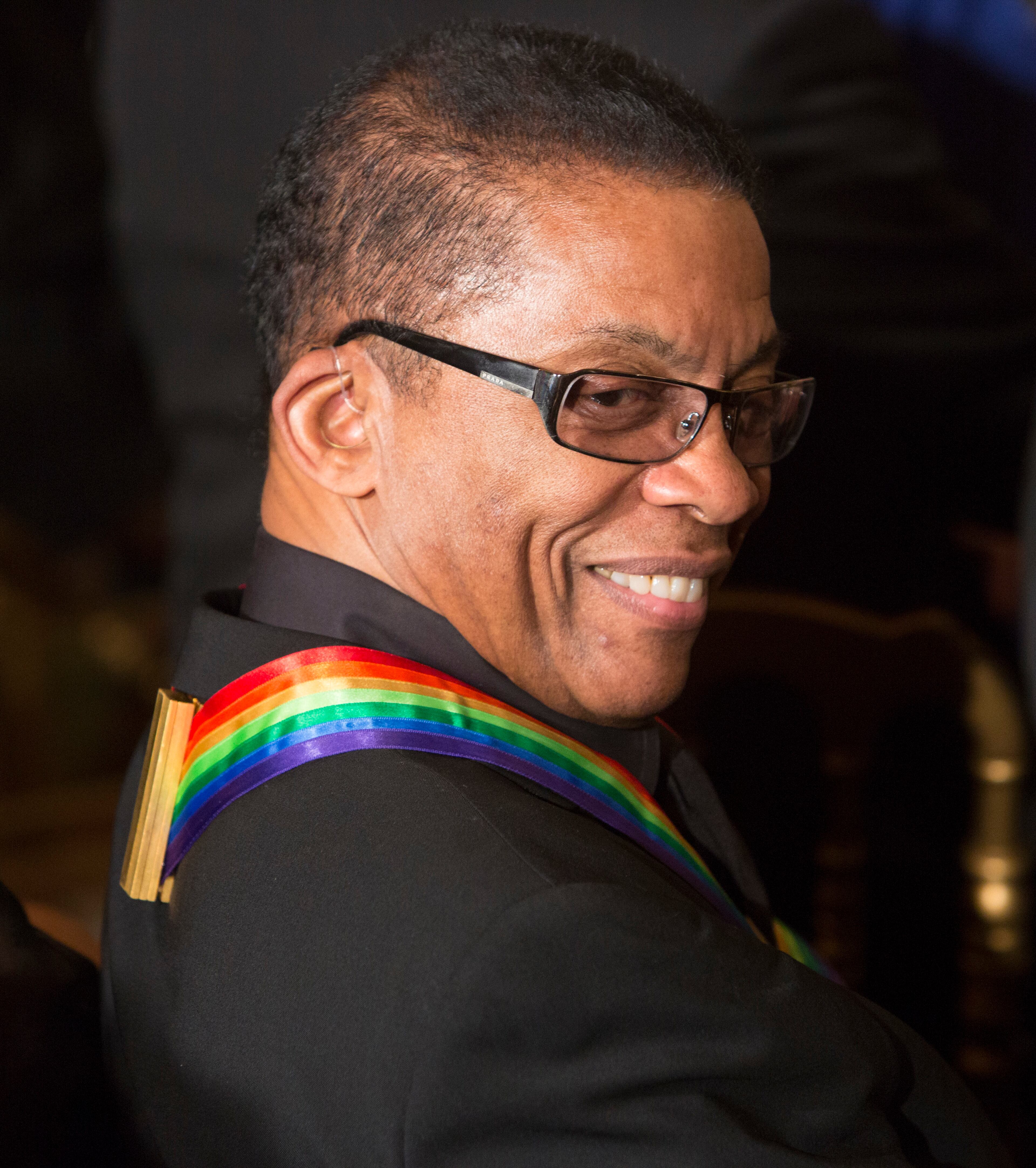 Musician Herbie Hancock chats before the start of a reception honoring the 2015 Kennedy Center Honors recipients December 6, 2015 at The White House in Washington, DC. AFP Photo / Chris Kleponis / AFP / CHRIS KLEPONIS (Photo credit should read CHRIS KLEPONIS/AFP/Getty Images)