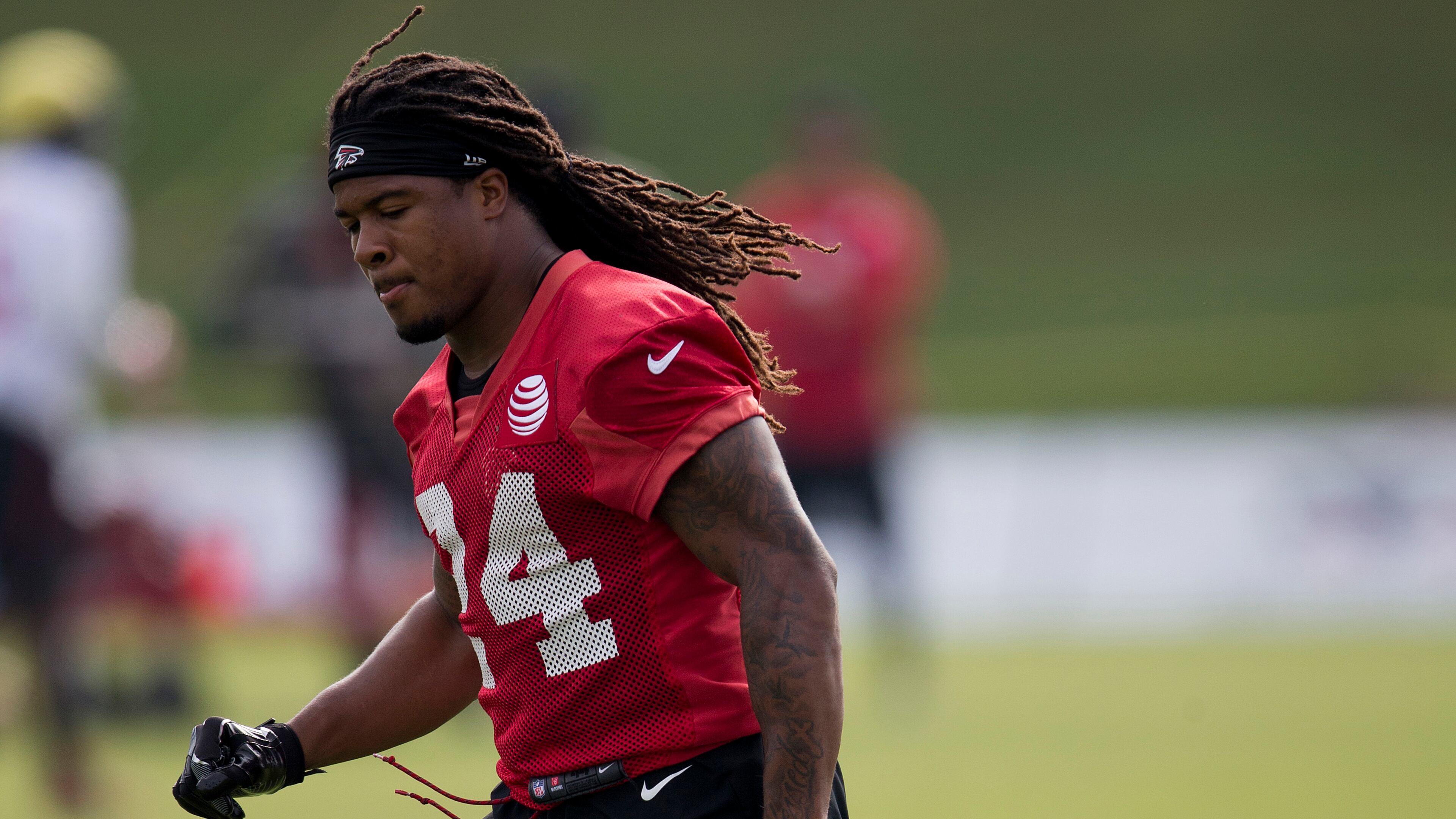 Atlanta Falcons running back Devonta Freeman (24) runs to a drill during the team's NFL training camp football practice Friday, July 28, 2017, in Flowery Branch.