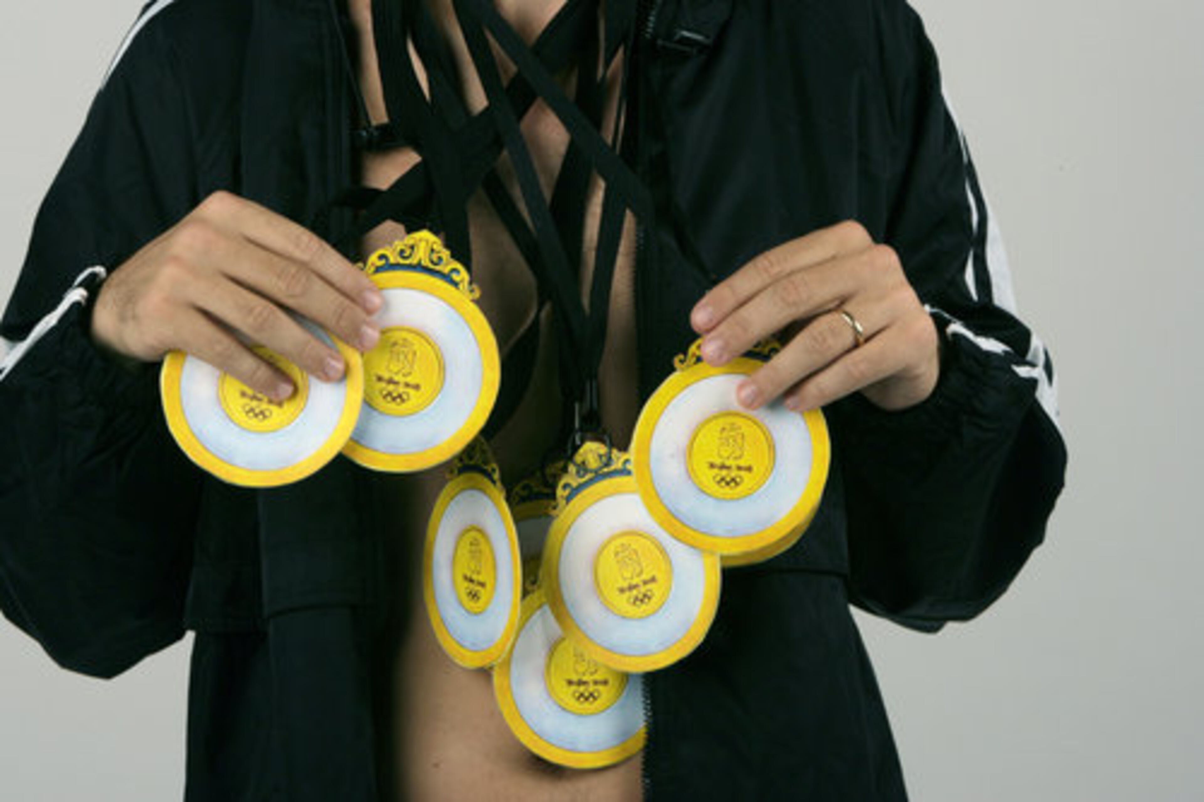 We made medals by printing out versions from a Web site and taping them to small plates. We exaggerated the size of the medal. We used lanyards or long shoe strings for the straps.