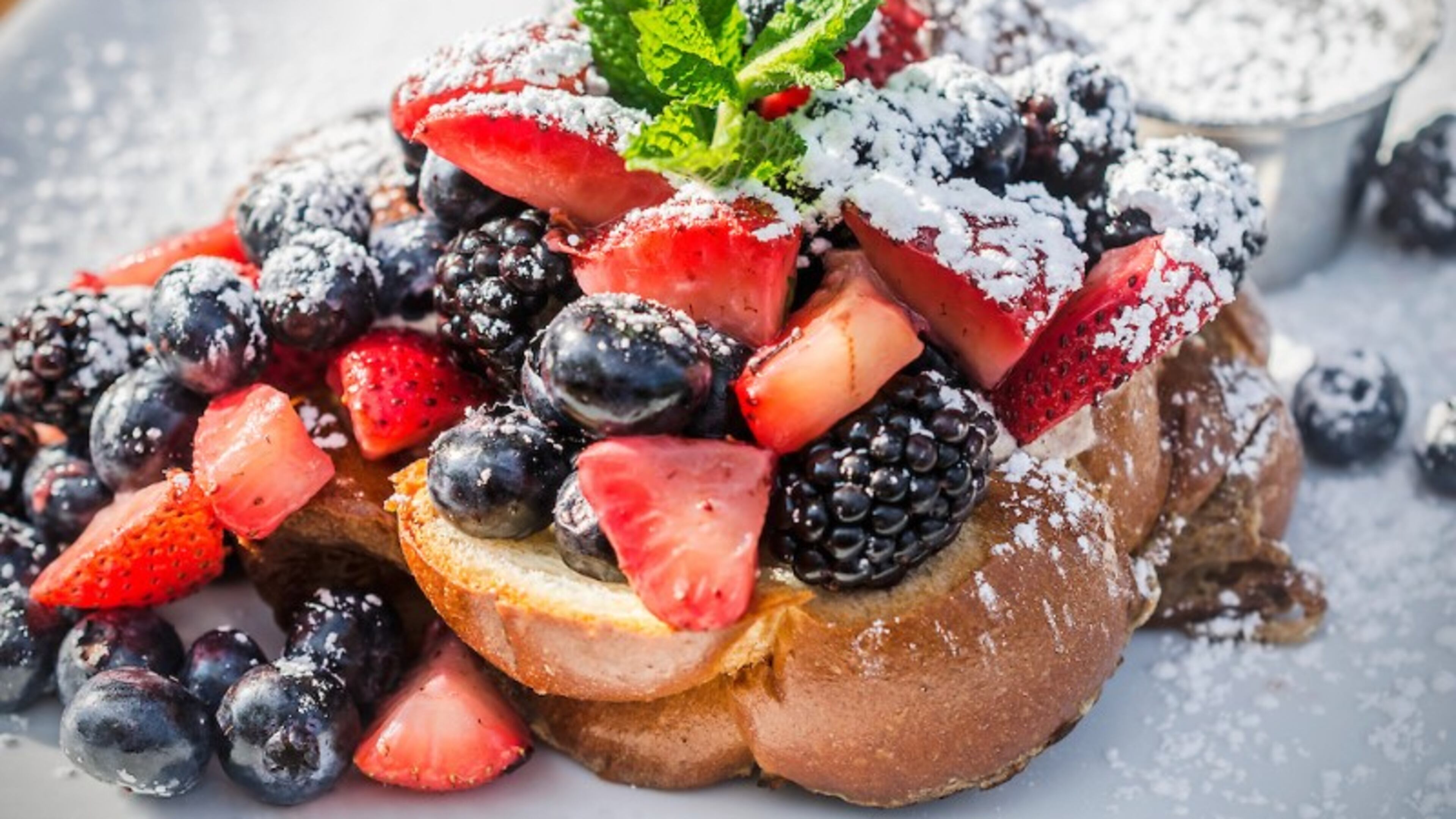 Decatur restaurant Sun in My Belly offers challah French toast stuffed with honeyed ricotta cheese and topped with seasonal fruit.