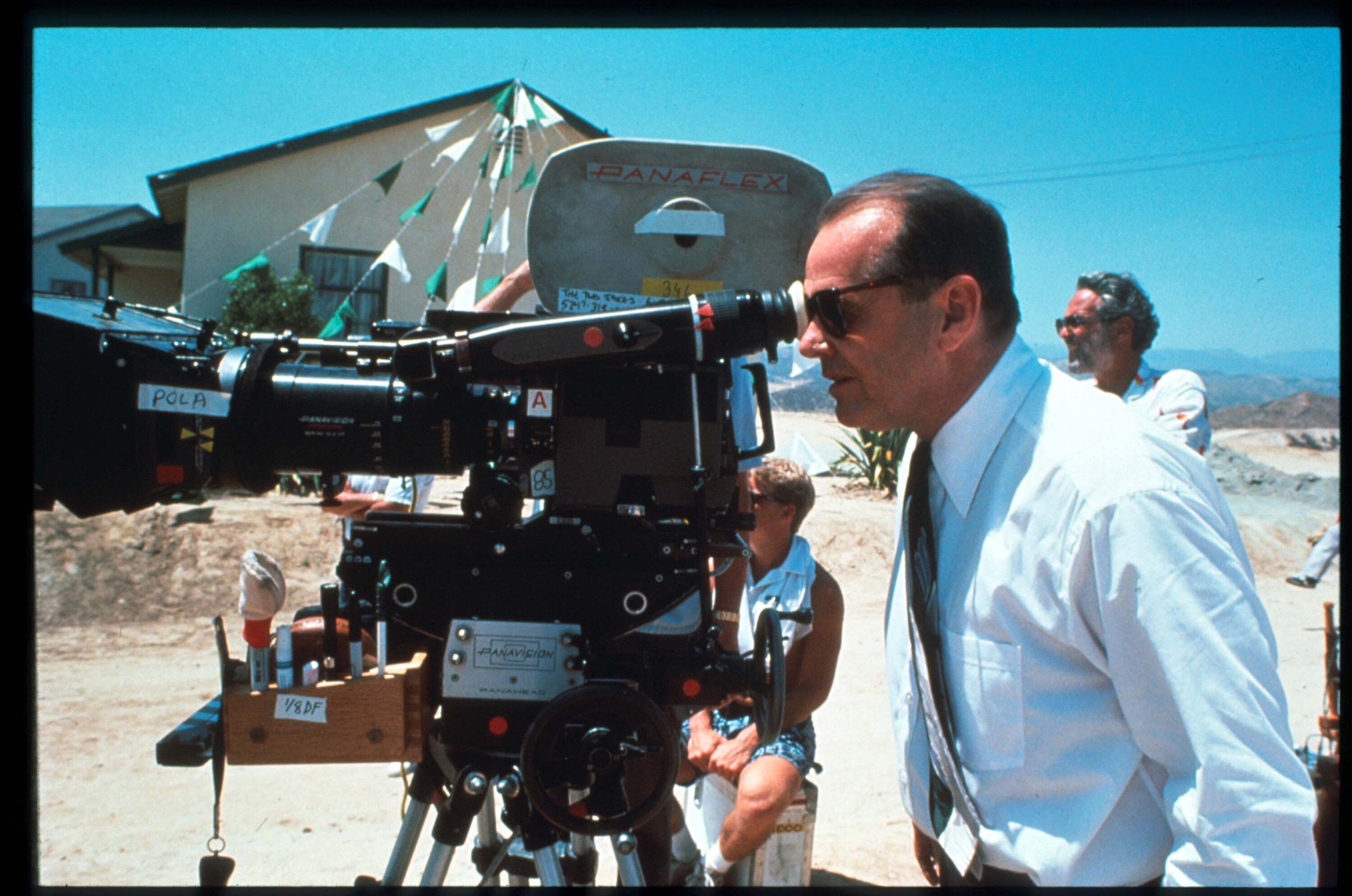 Actor and director Jack Nicholson looks into the viewfinder of a PanaFlex camera on the set of "The Two Jakes," the sequel to "Chinatown," on Sept. 1, 1989.