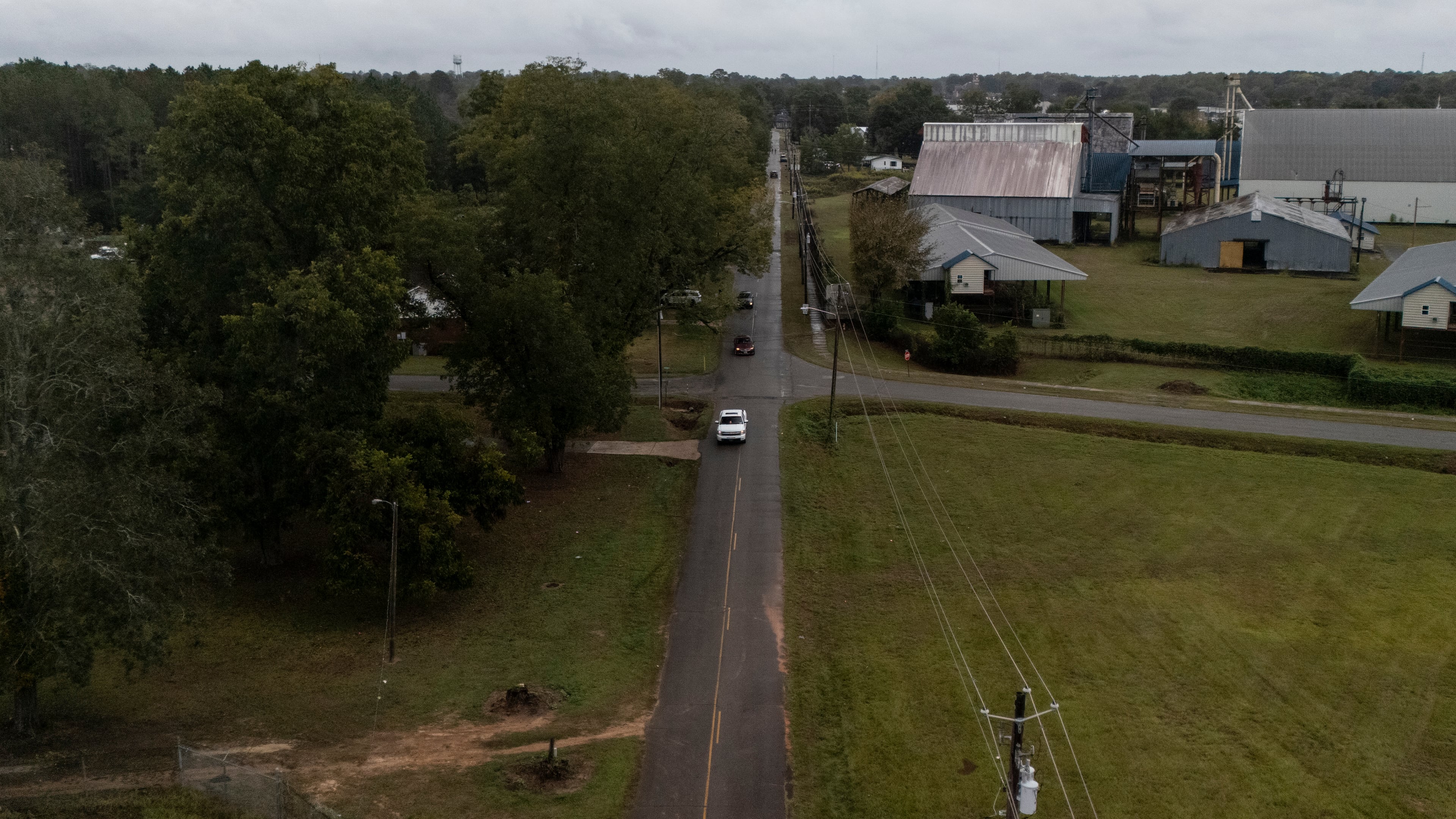 Vehicles drive past the scene of a mass shooting where two people died and 35 were injured Sunday morning, according to the Georgia Bureau of Investigation. (Mike Stewart/AP)