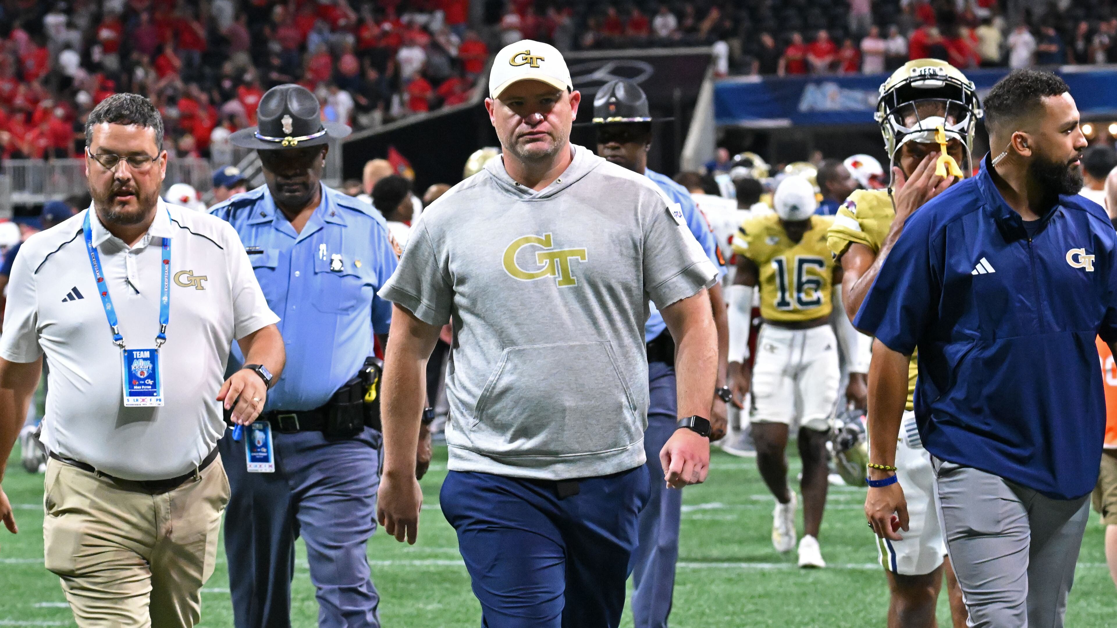 Georgia Tech's head coach Brent Key leaves the football field after Louisville defeat Georgia Tech during the inaugural Aflac Kickoff Game at Mercedes-Benz Stadium, Friday, September 1, 2023, in Atlanta. Louisville won 39-34 over Georgia Tech. (Hyosub Shin / Hyosub.Shin@ajc.com)