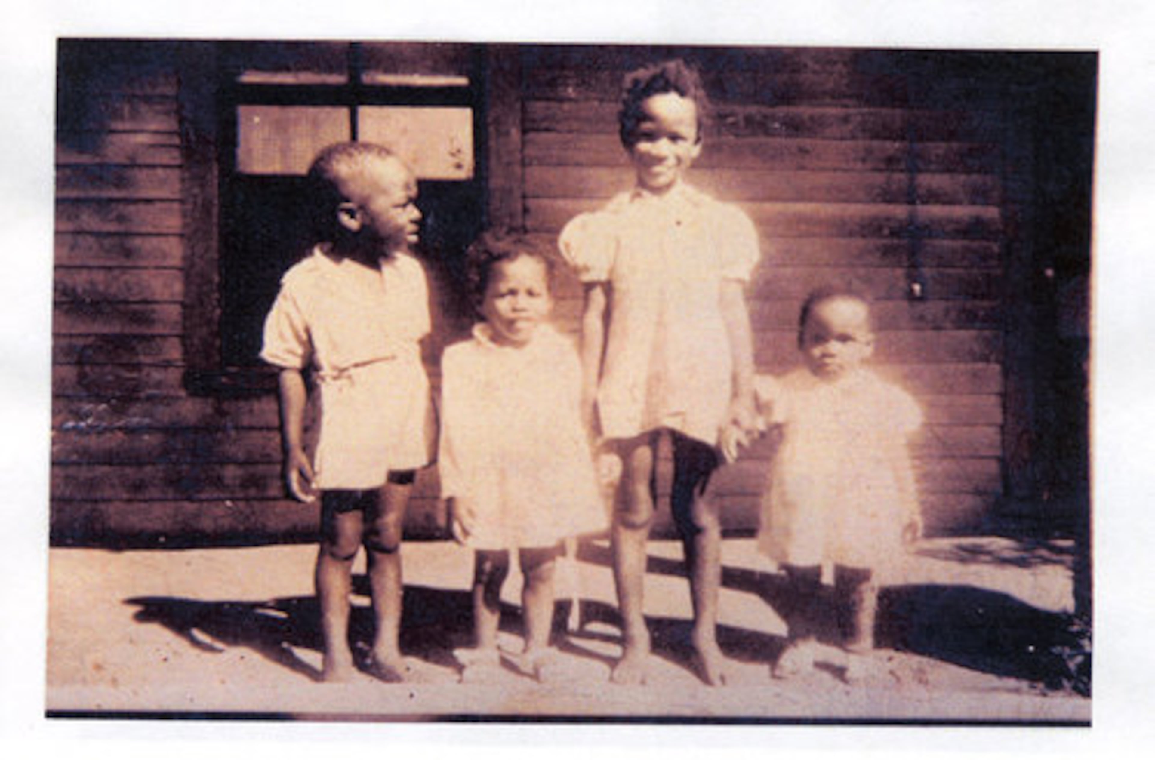 Marcia Glenn Hunter, shown here with her siblings and a playmate in the mid -1940s, grew up in a three-room shack in Lithonia and never knew any of her grandparents.