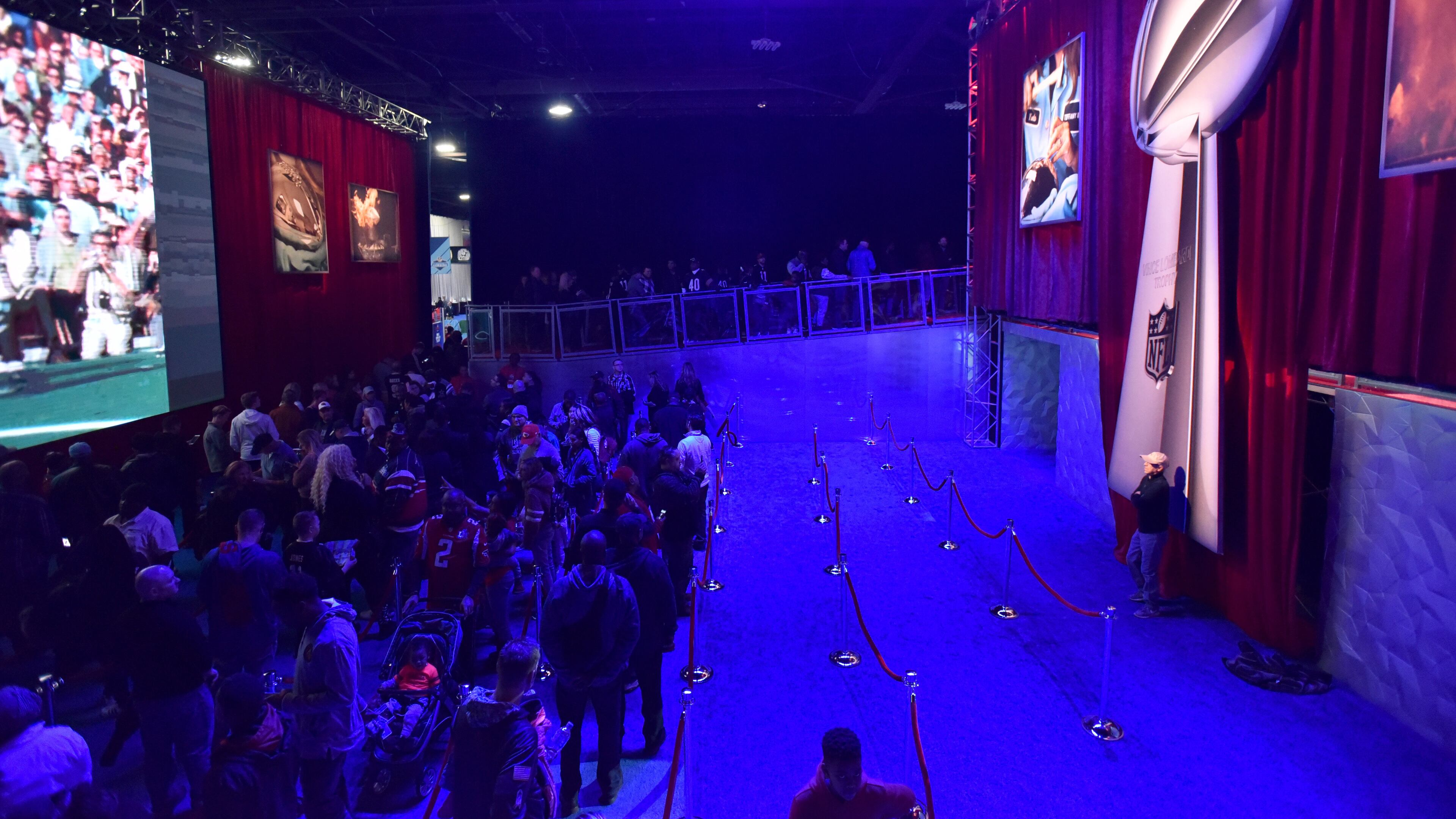 Visitors line up to take their photograph with the Vince Lombardi Trophy during Super Bowl Experience inside Georgia World Congress Center on Wednesday, January 30, 2019. (HYOSUB SHIN / HSHIN@AJC.COM)