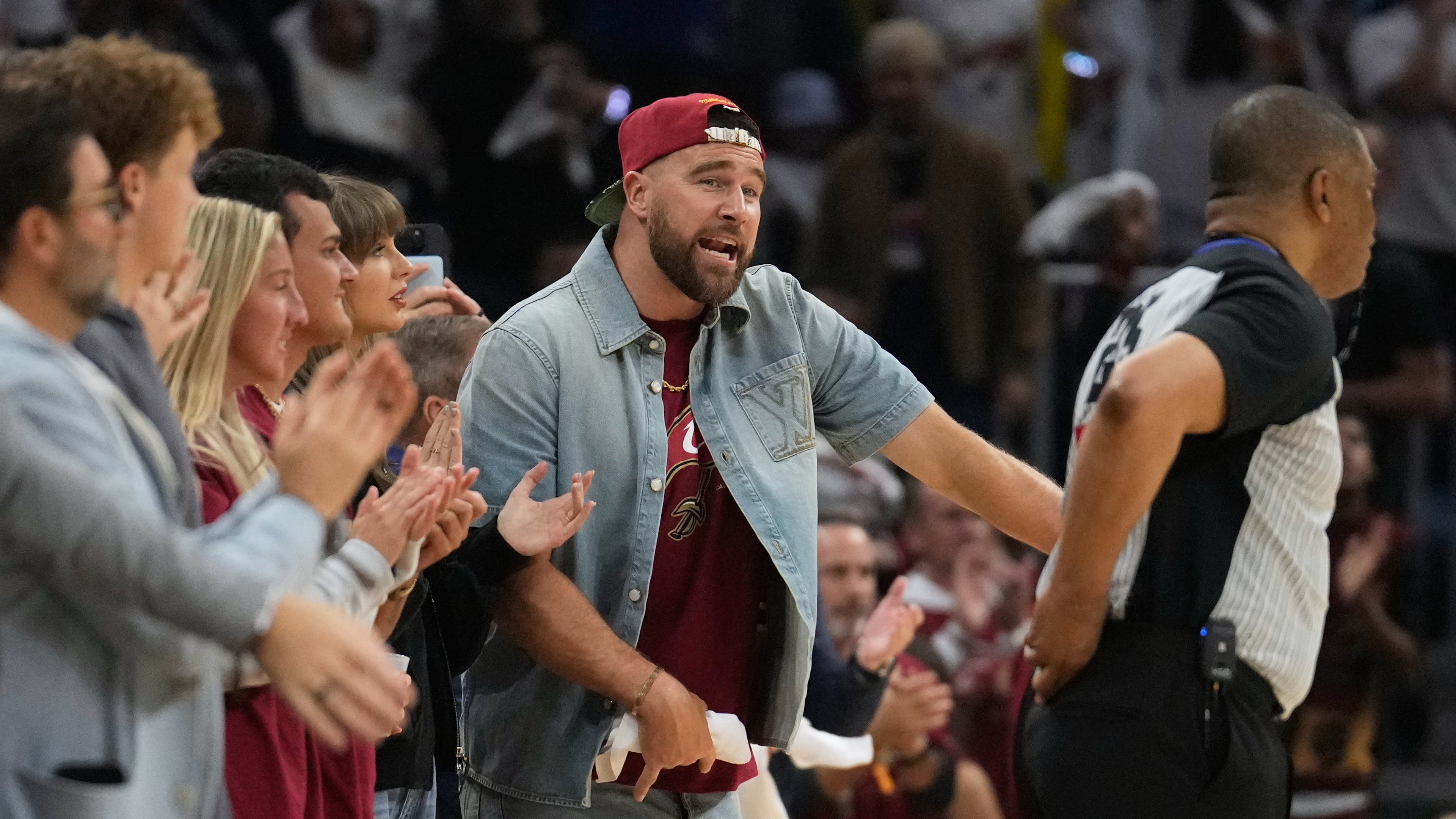 Travis Kelce reacts during the second half of Game 3 in the Eastern Conference finals NBA basketball playoffs series between the New York Knicks and the Cleveland Cavaliers in Cleveland, Saturday, May 23, 2026. (AP Photo/Sue Ogrocki)