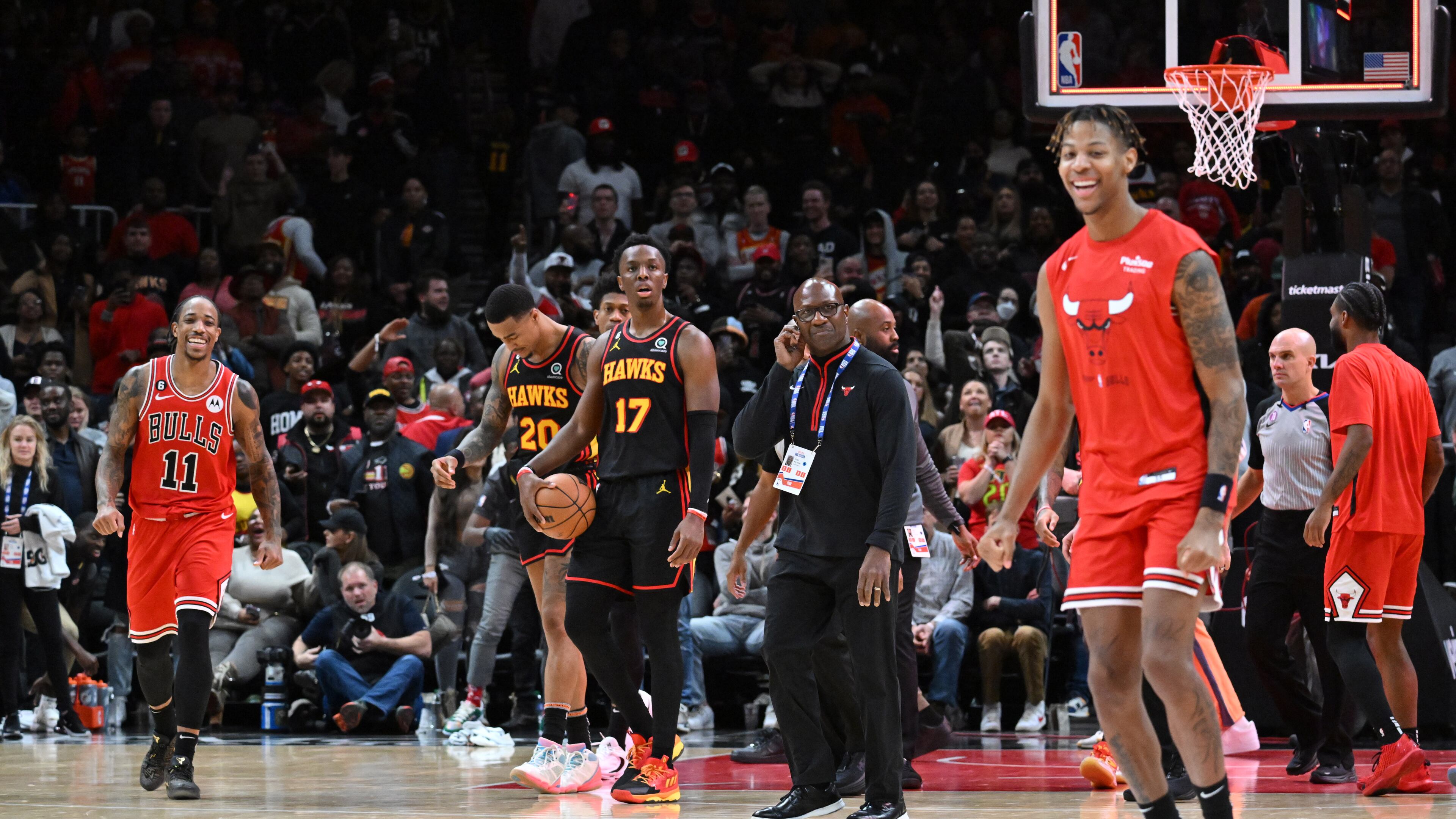 Hawks players react as Chicago Bulls players celebrate their win at the end of the fourth quarter in an NBA basketball game at State Farm Arena on Wednesday, December 21, 2022. (Hyosub Shin / Hyosub.Shin@ajc.com)