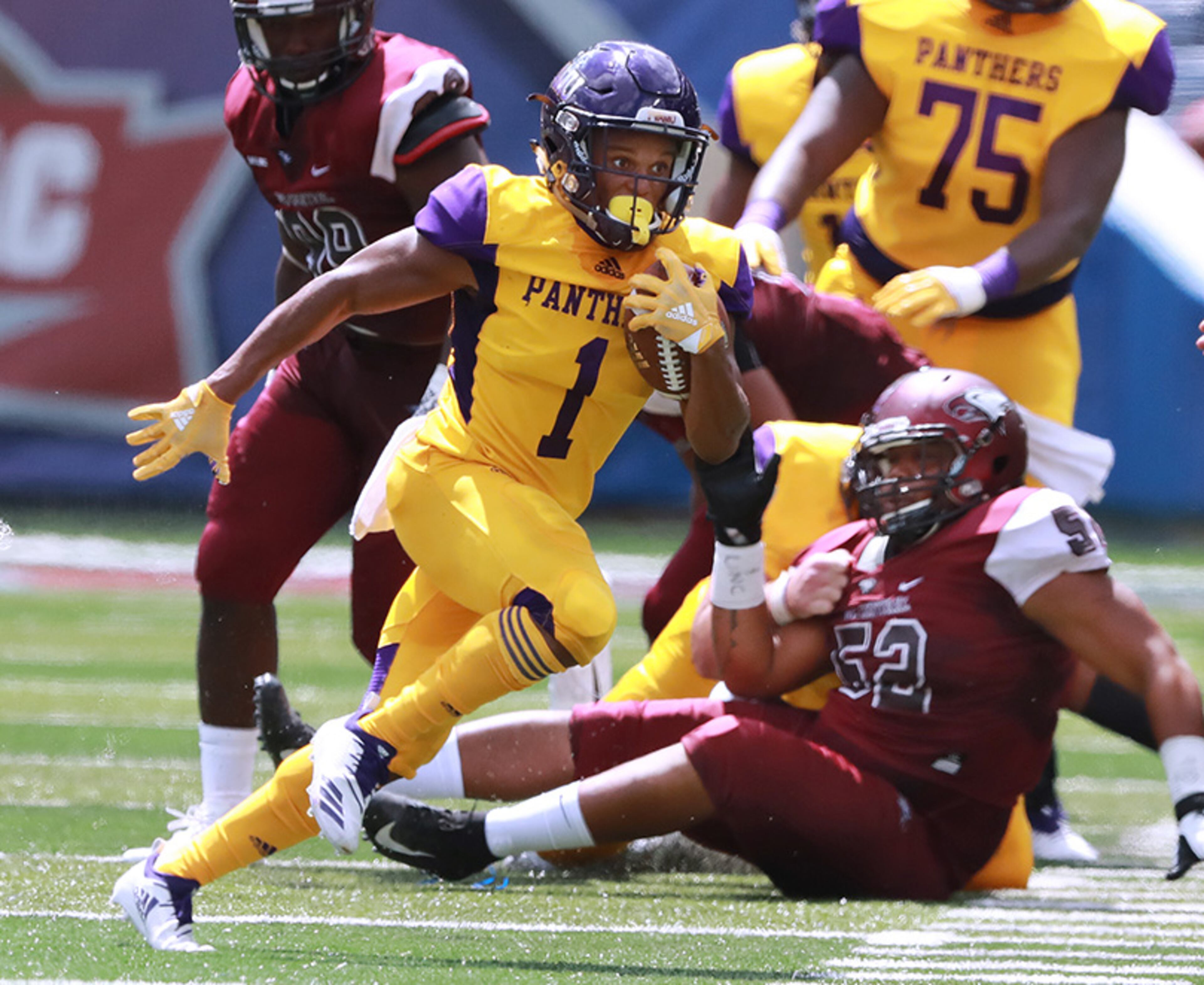 Prairie View A&M running back Dawonya Tucker breaks away from North Carolina Central defender Carl Isaac during the MEAC-SWAC Challenge Sunday, Sept. 2, 2018, in Atlanta.