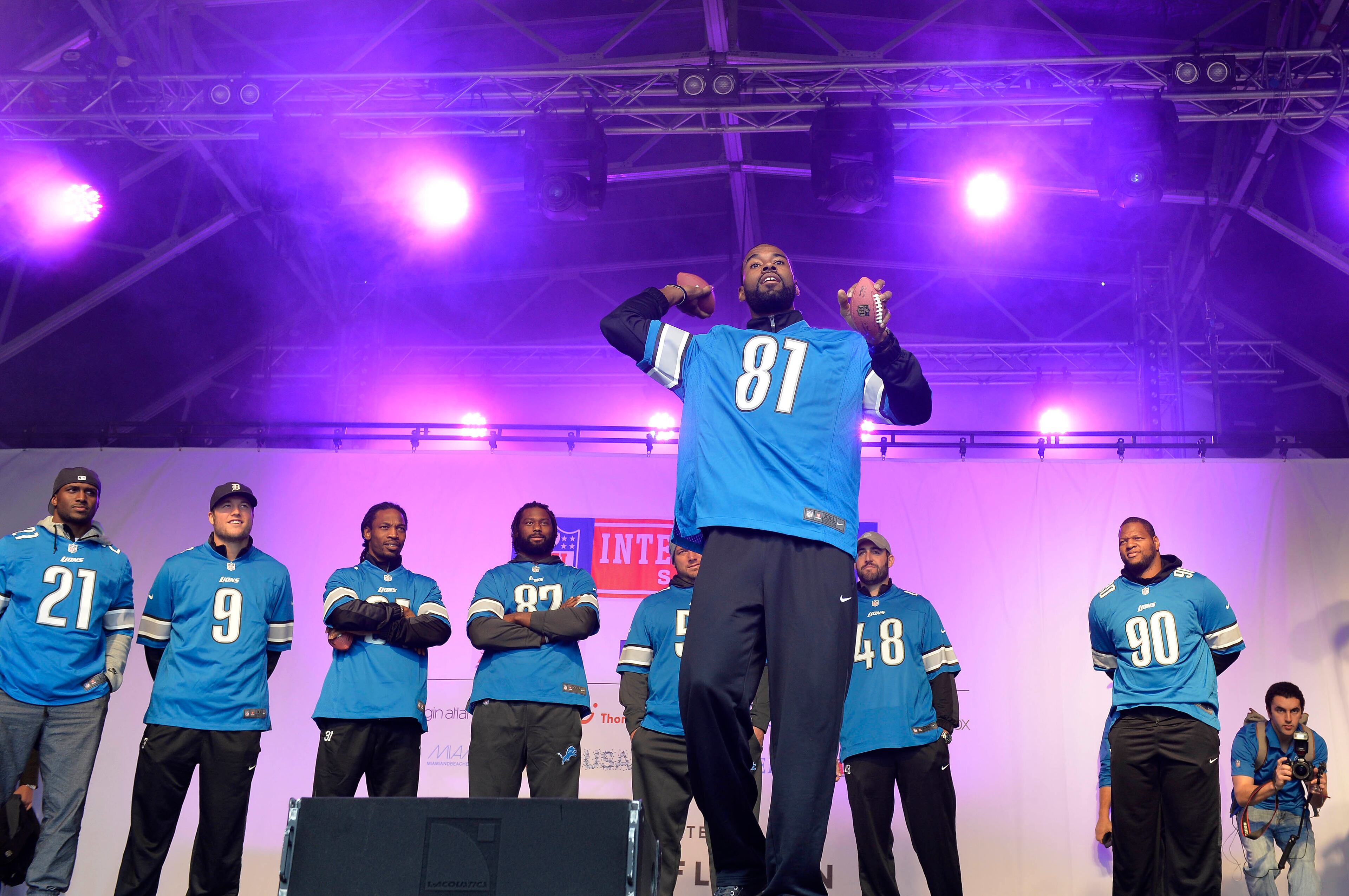Former Georgia Tech star Calvin Johnson of the Detroit Lions throws a ball into the crowd at the NFL Fan Rally. Sean Ryan /NFL