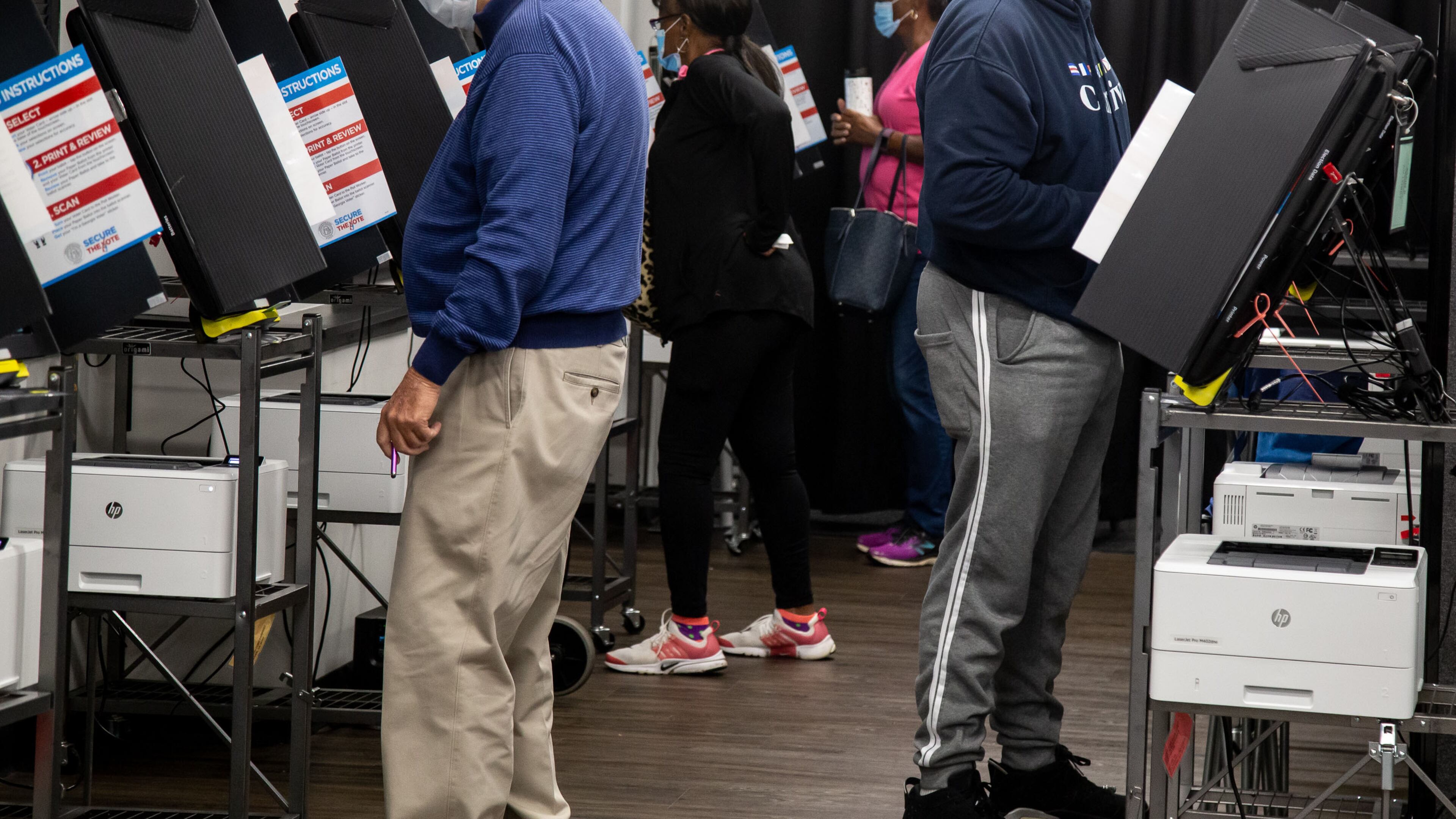 People cast their vote at a Cobb County polling center on Whitlock Ave in Marietta, October 12, 2020. STEVE SCHAEFER / SPECIAL TO THE AJC