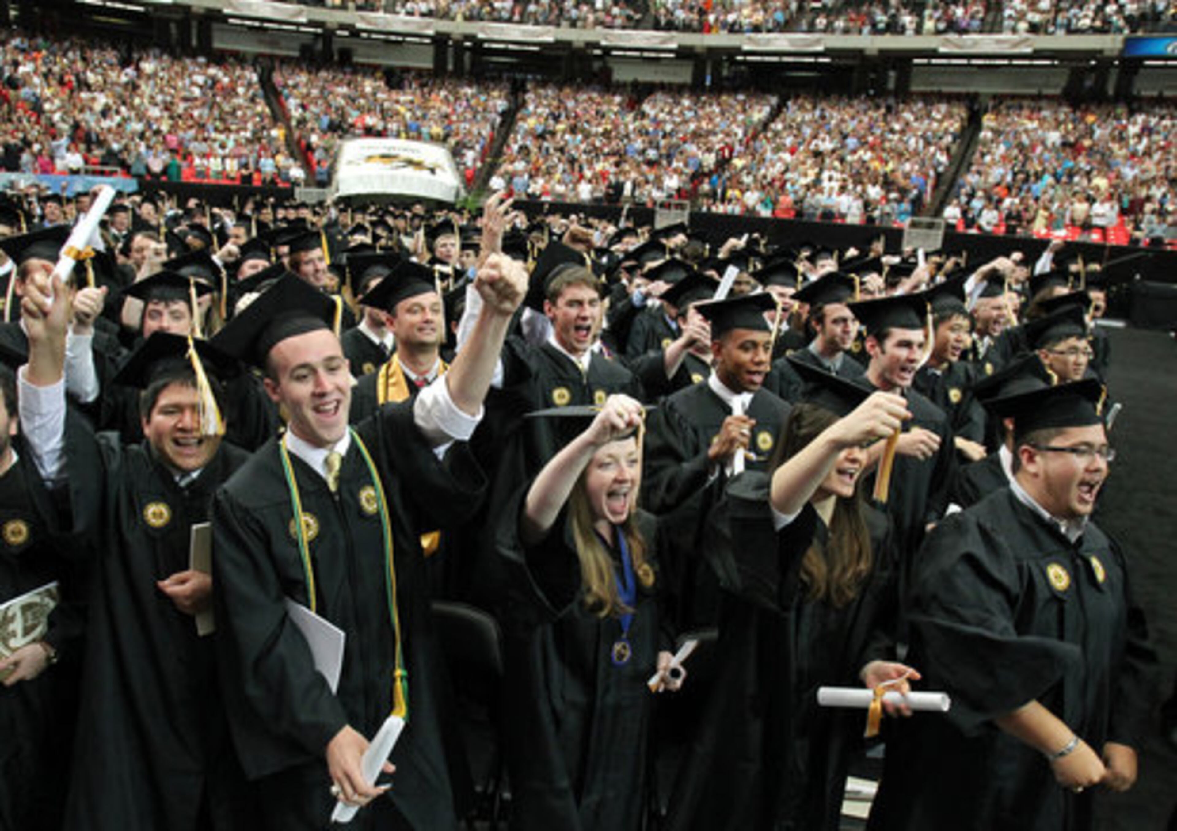 Georgia Tech graduates sing the school's fight song as ceremonies conclude.